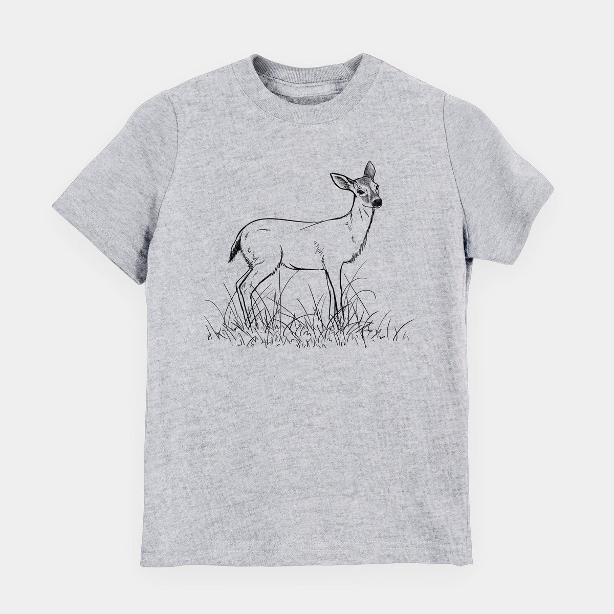 Heather grey youth t-shirt laid flat, printed with a black ink sketch of a black-tailed deer standing in tall grass.