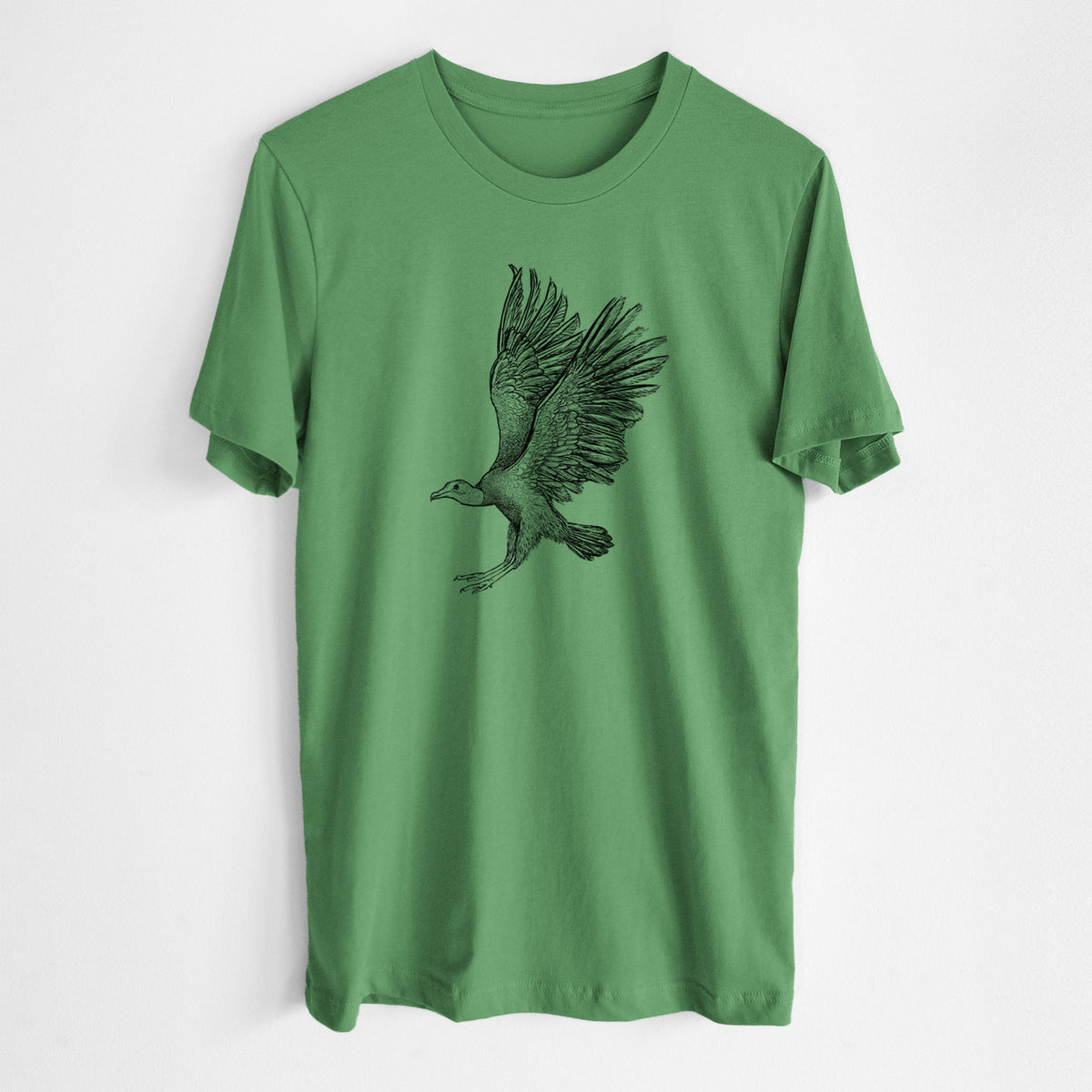 Leaf green lightweight cotton t-shirt laid flat, printed with a detailed black ink illustration of a black vulture landing with its wings spread.
