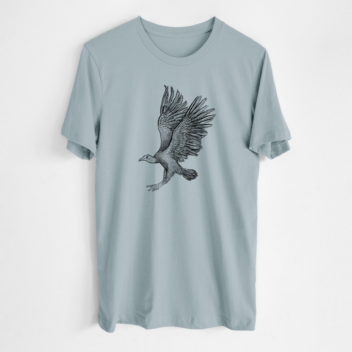 Vintage denim lightweight cotton t-shirt laid flat, printed with a detailed black ink illustration of a black vulture landing with its wings spread.