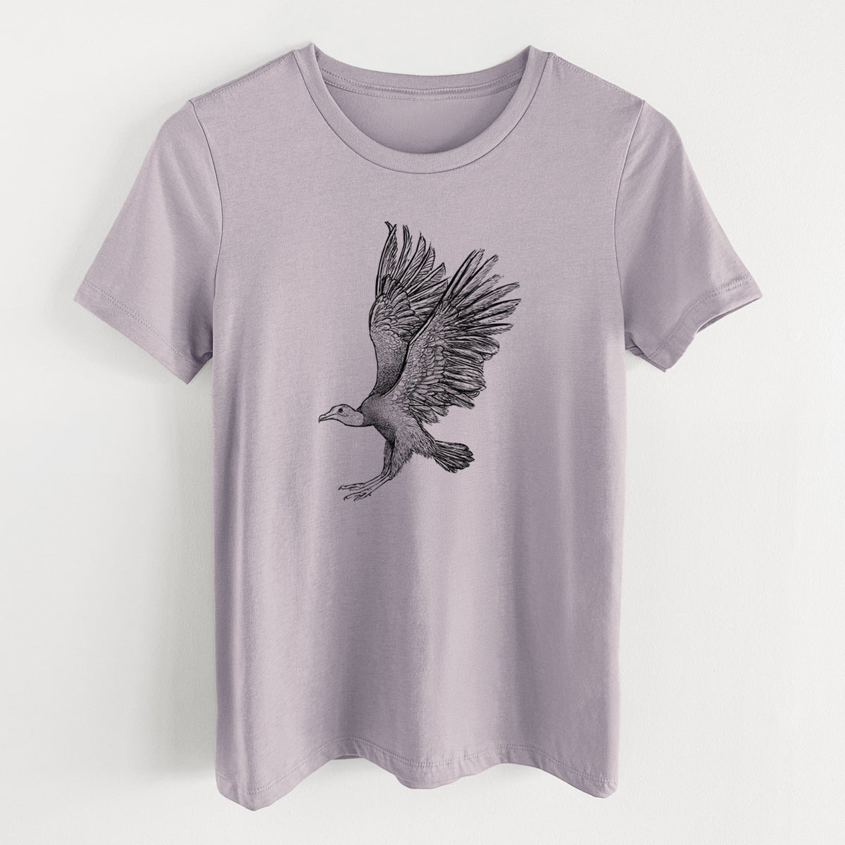 Light violet women's relaxed fit cotton t-shirt laid flat, printed with a detailed black ink illustration of a black vulture landing with its wings spread.