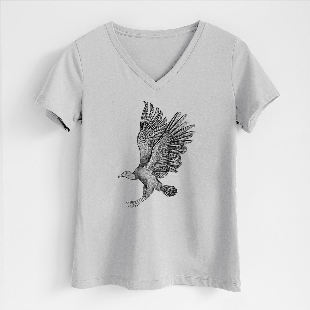 Lunar grey women's relaxed fit cotton V-neck t-shirt laid flat, printed with a detailed black ink illustration of a black vulture landing with its wings spread.