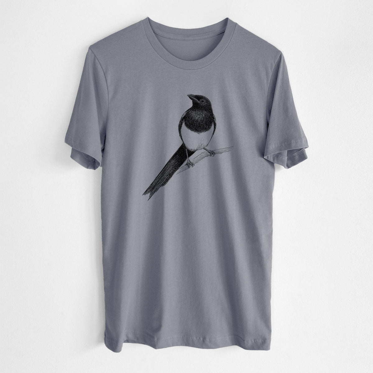 Storm grey lightweight cotton t-shirt laid flat, printed with a detailed black ink sketch of a black-billed magpie perched on a branch with its long tail.