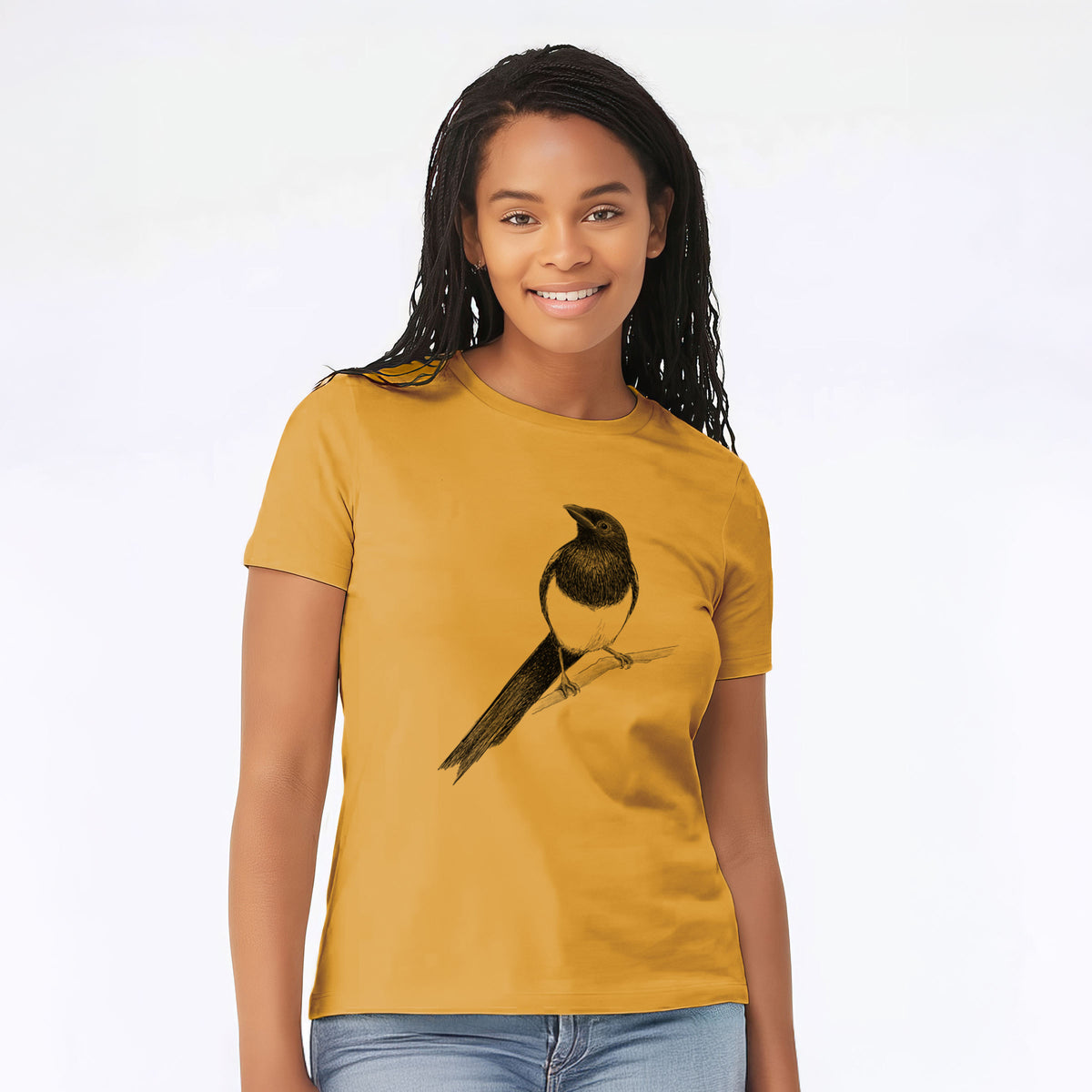Woman wearing a mustard yellow women's relaxed fit cotton t-shirt printed with a detailed black ink sketch of a black-billed magpie perched on a branch with its long tail.