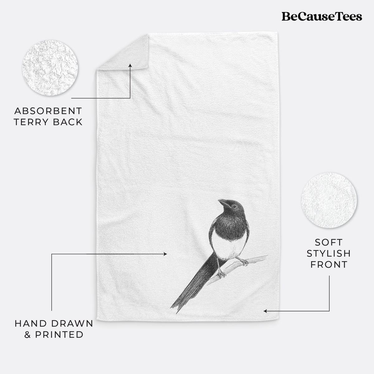 White hand towel printed with a detailed black ink sketch of a black-billed magpie perched on a branch with its long tail.