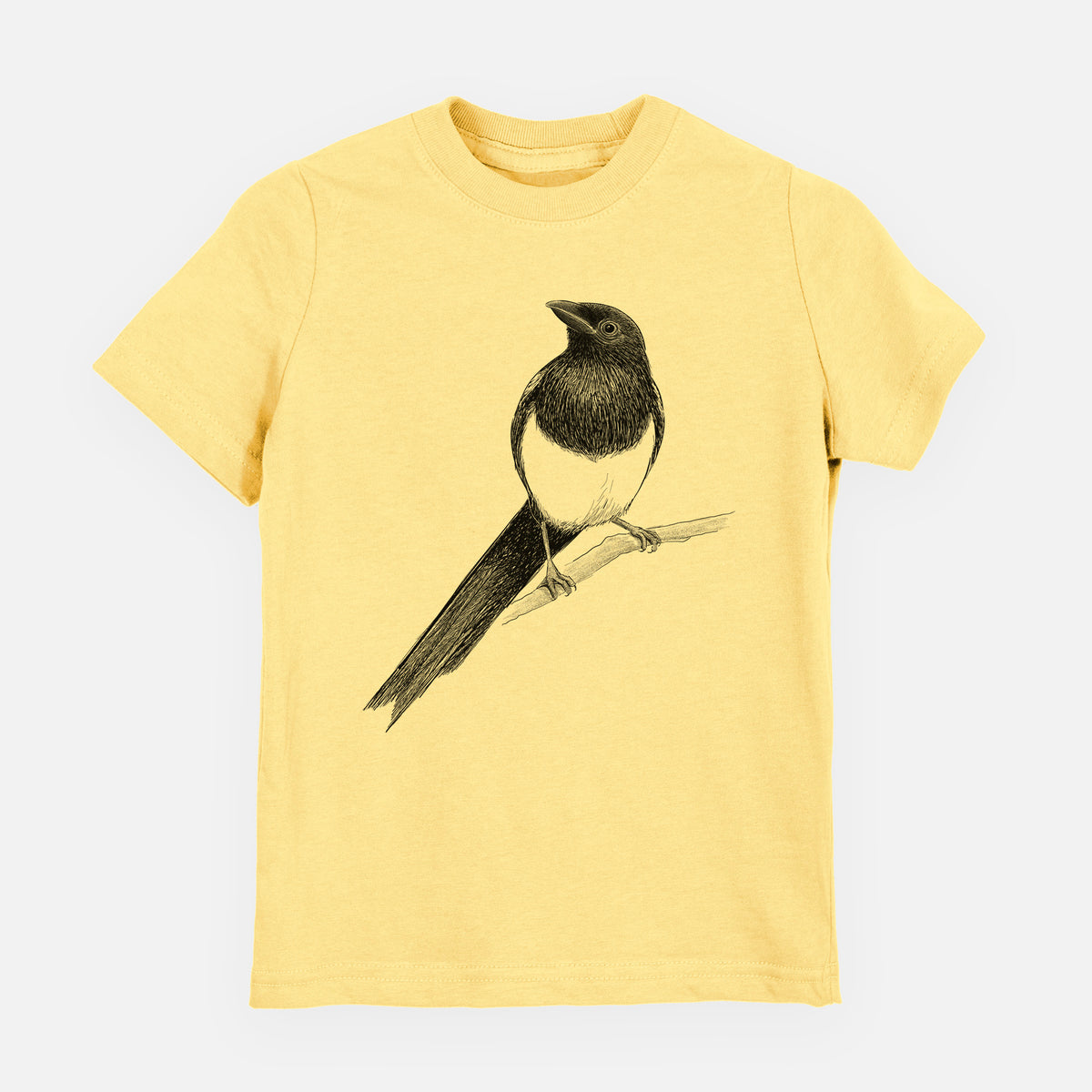 Butter yellow youth t-shirt laid flat, printed with a detailed black ink sketch of a black-billed magpie perched on a branch with its long tail.