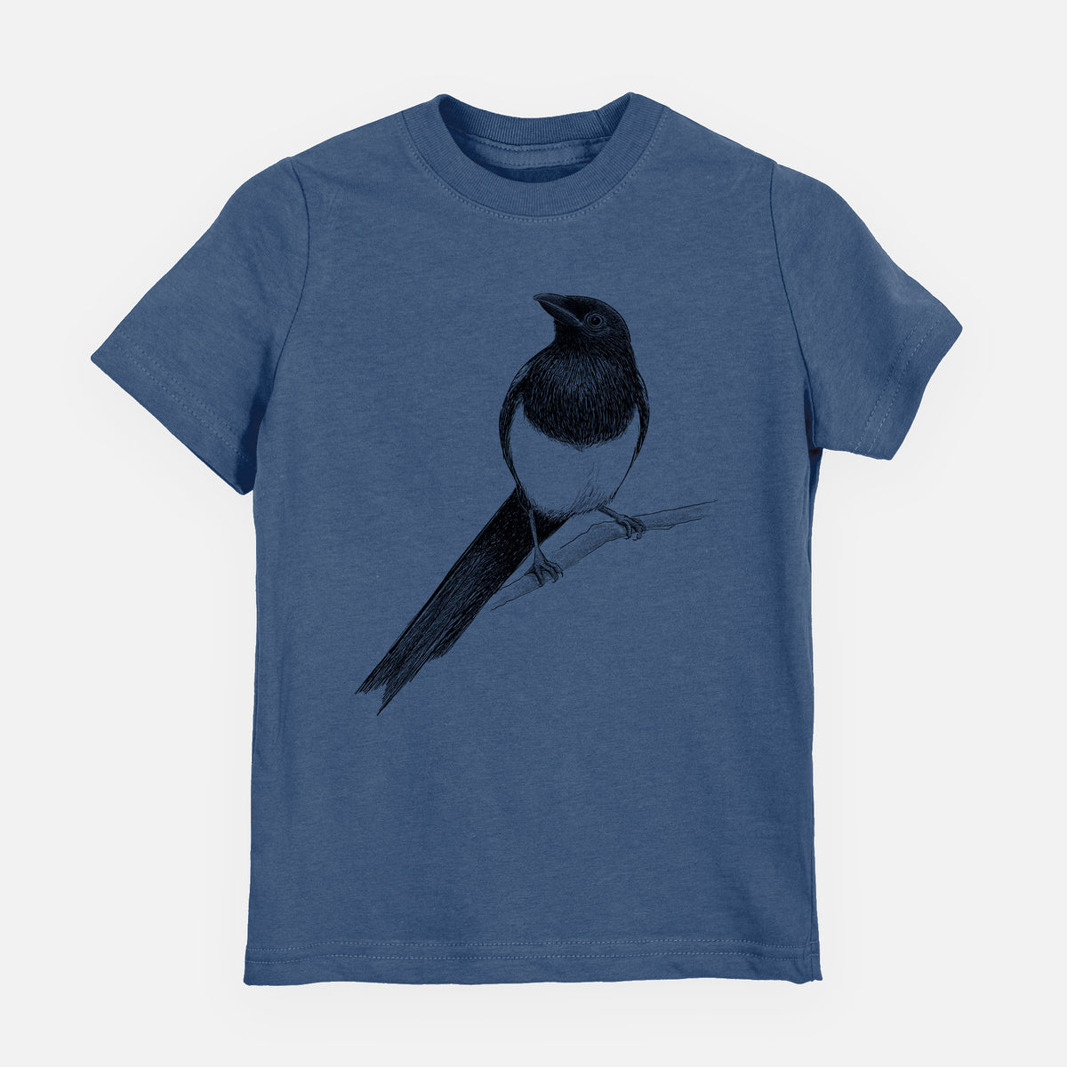 Indigo blue youth t-shirt laid flat, printed with a detailed black ink sketch of a black-billed magpie perched on a branch with its long tail.