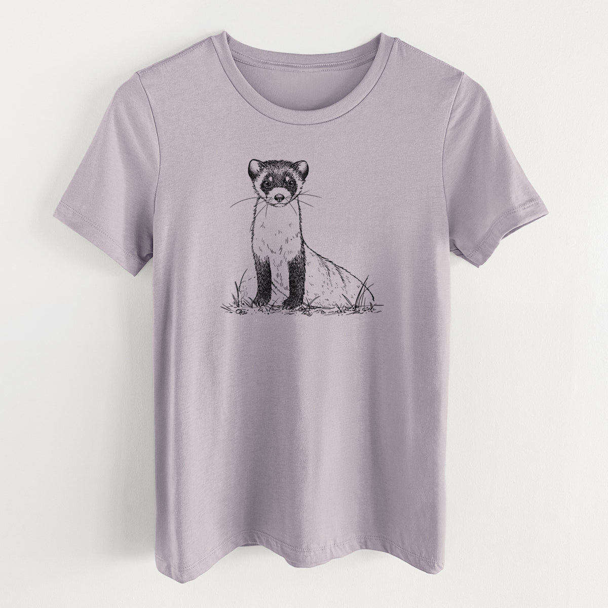 Light violet women's relaxed fit cotton t-shirt laid flat, printed with a detailed black ink illustration of a black-footed ferret sitting on the ground.