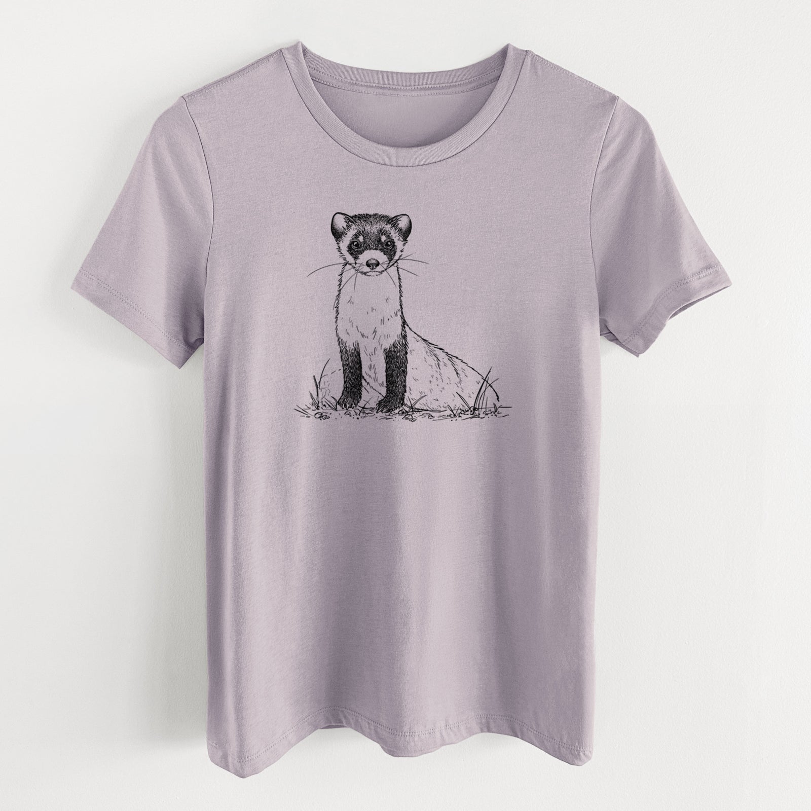 Light violet women's relaxed fit cotton t-shirt laid flat, printed with a detailed black ink illustration of a black-footed ferret sitting on the ground.