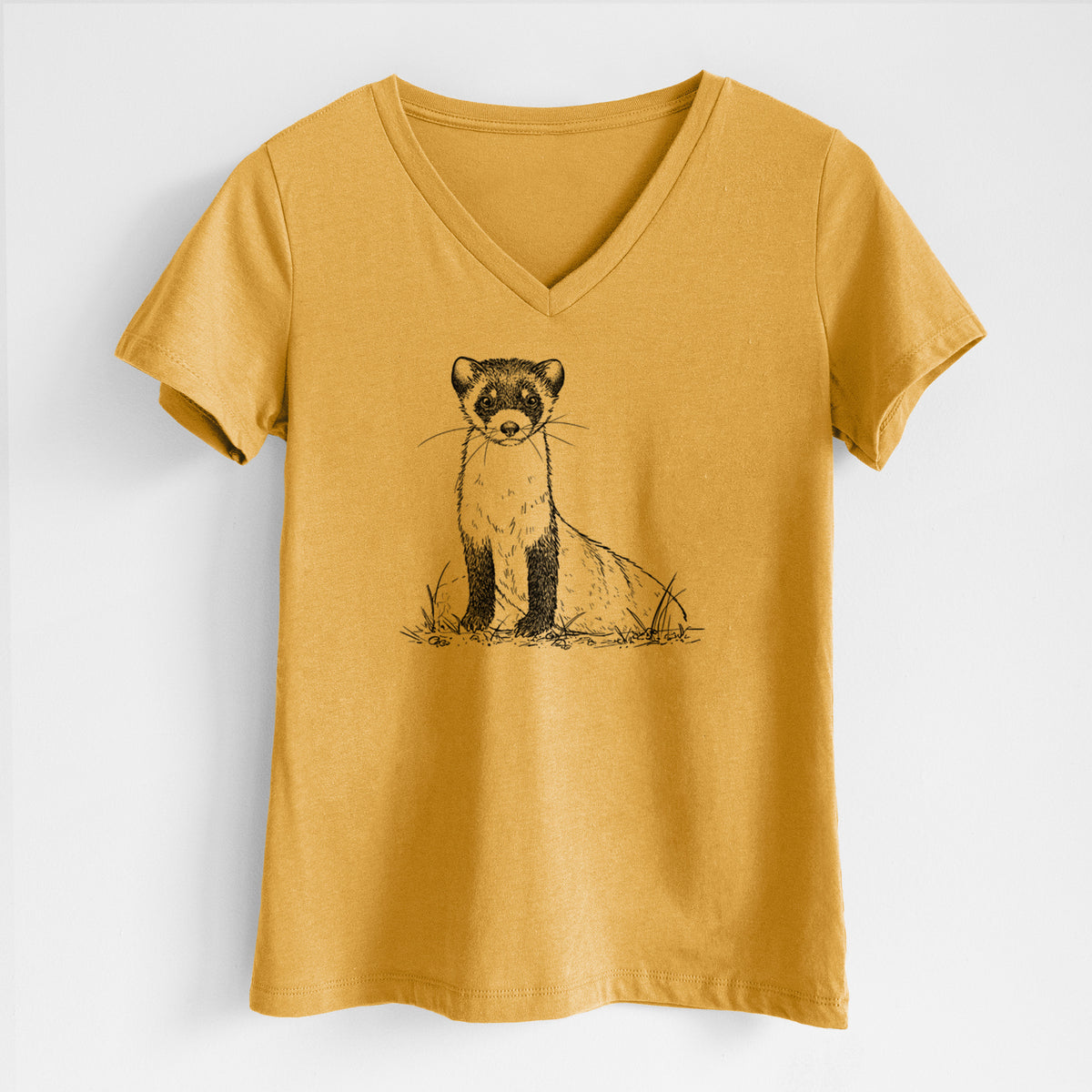 Honeycomb yellow women's relaxed fit cotton V-neck t-shirt laid flat, printed with a detailed black ink illustration of a black-footed ferret sitting on the ground.