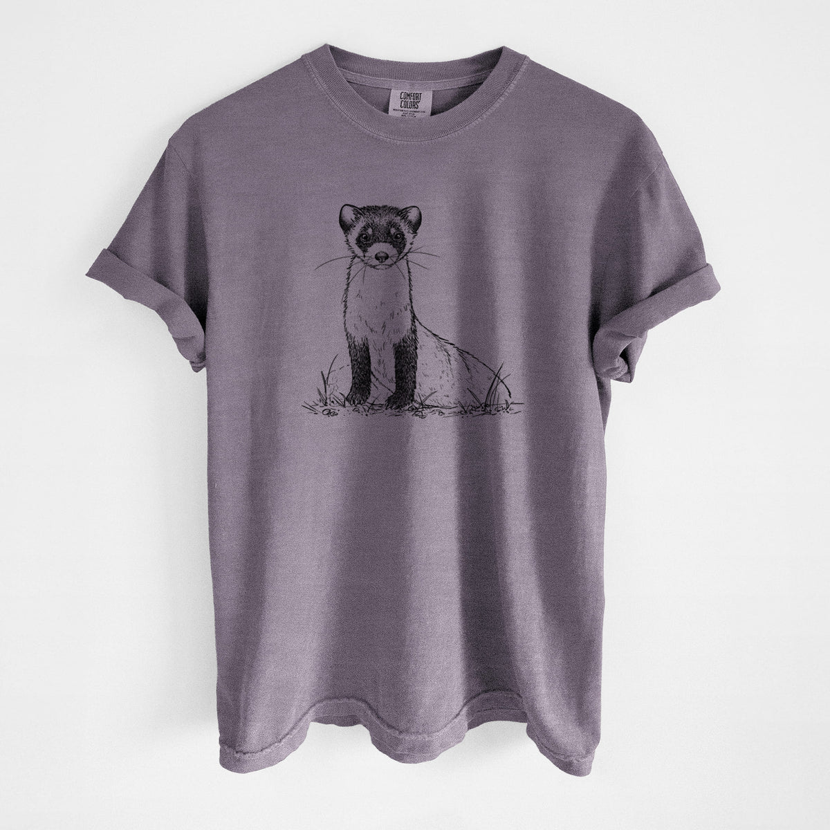 Wine red Comfort Colors t-shirt laid flat, printed with a detailed black ink illustration of a black-footed ferret sitting on the ground.