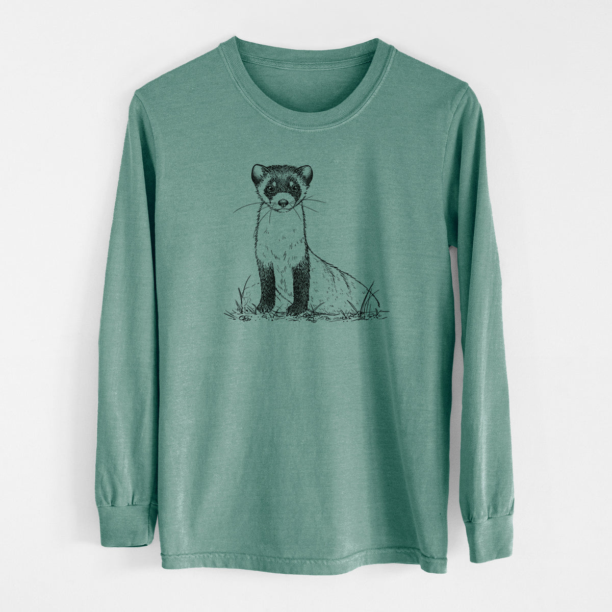 Pine green Comfort Colors long sleeve shirt laid flat, printed with a detailed black ink illustration of a black-footed ferret sitting on the ground.