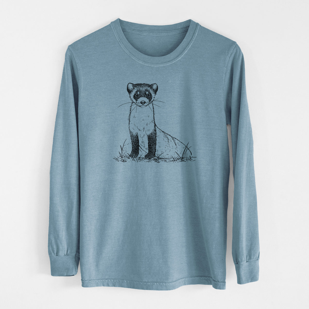 Steel blue Comfort Colors long sleeve shirt laid flat, printed with a detailed black ink illustration of a black-footed ferret sitting on the ground.