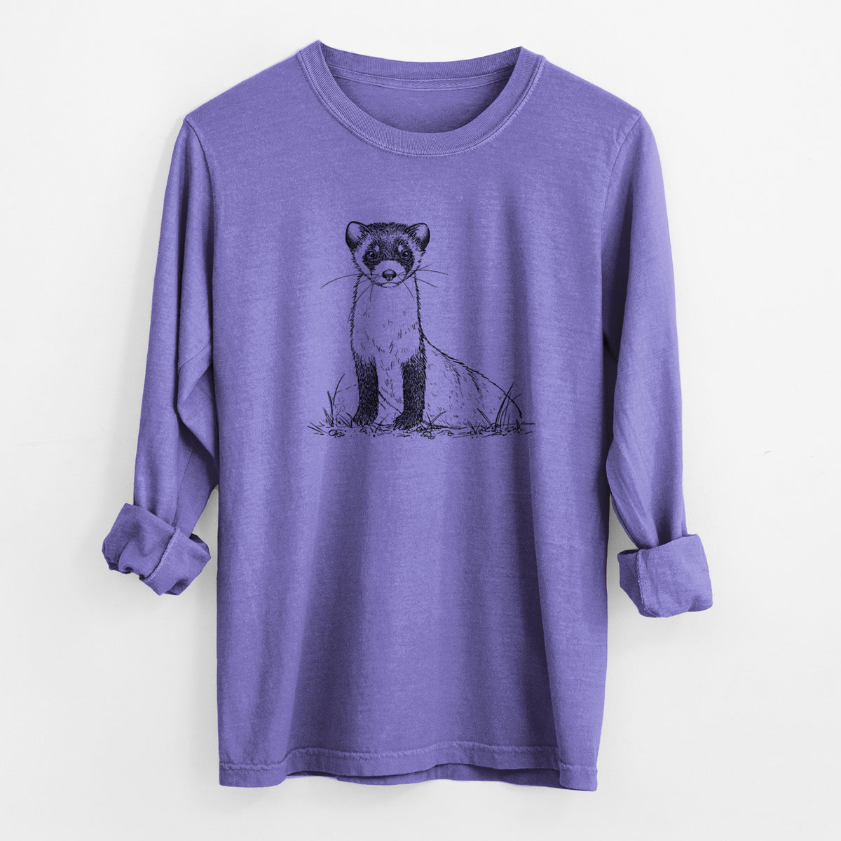 Violet purple Comfort Colors long sleeve shirt laid flat with the cuffs rolled, printed with a detailed black ink illustration of a black-footed ferret sitting on the ground.