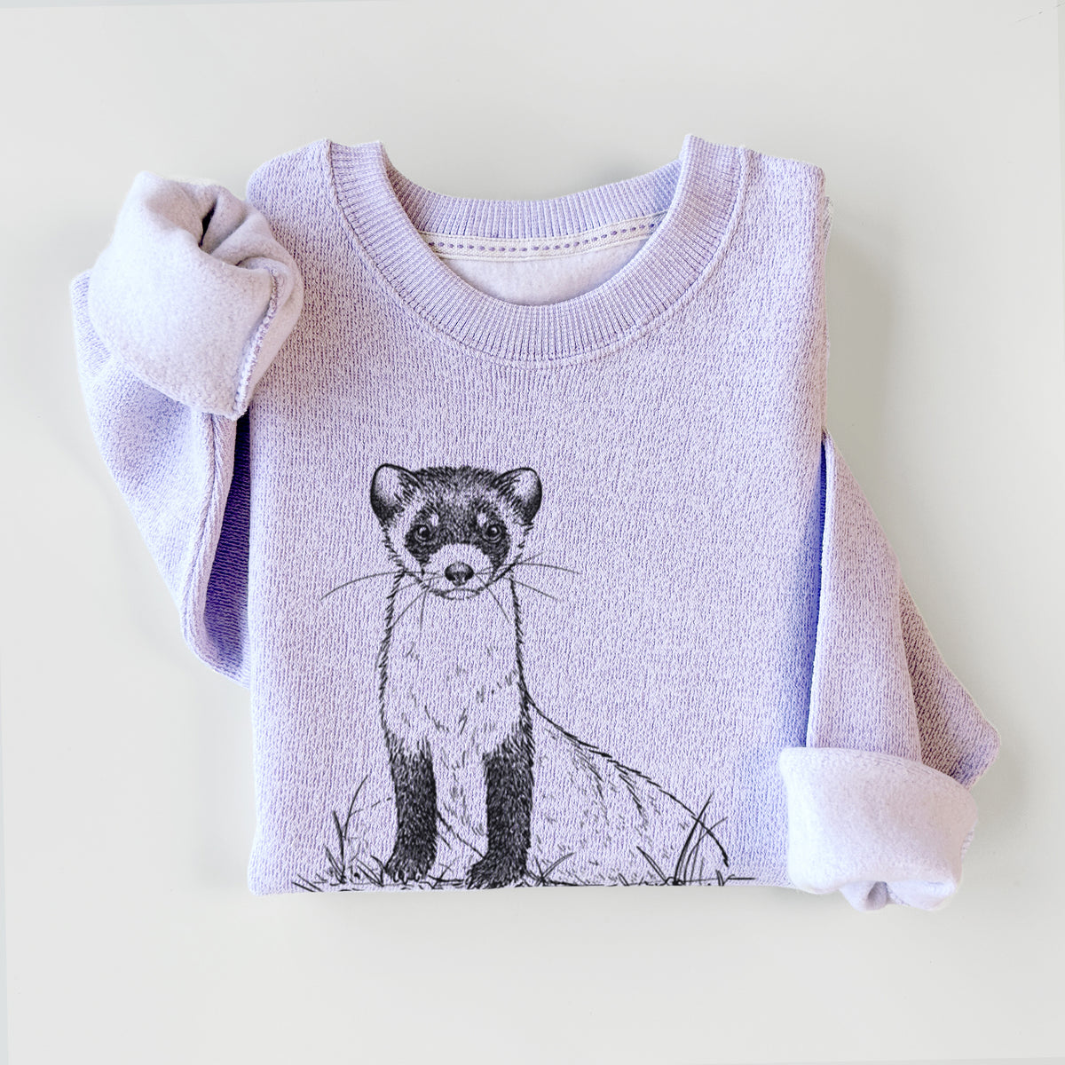 Ice purple knit sweatshirt printed with a detailed black ink illustration of a black-footed ferret sitting on the ground, styled flat.