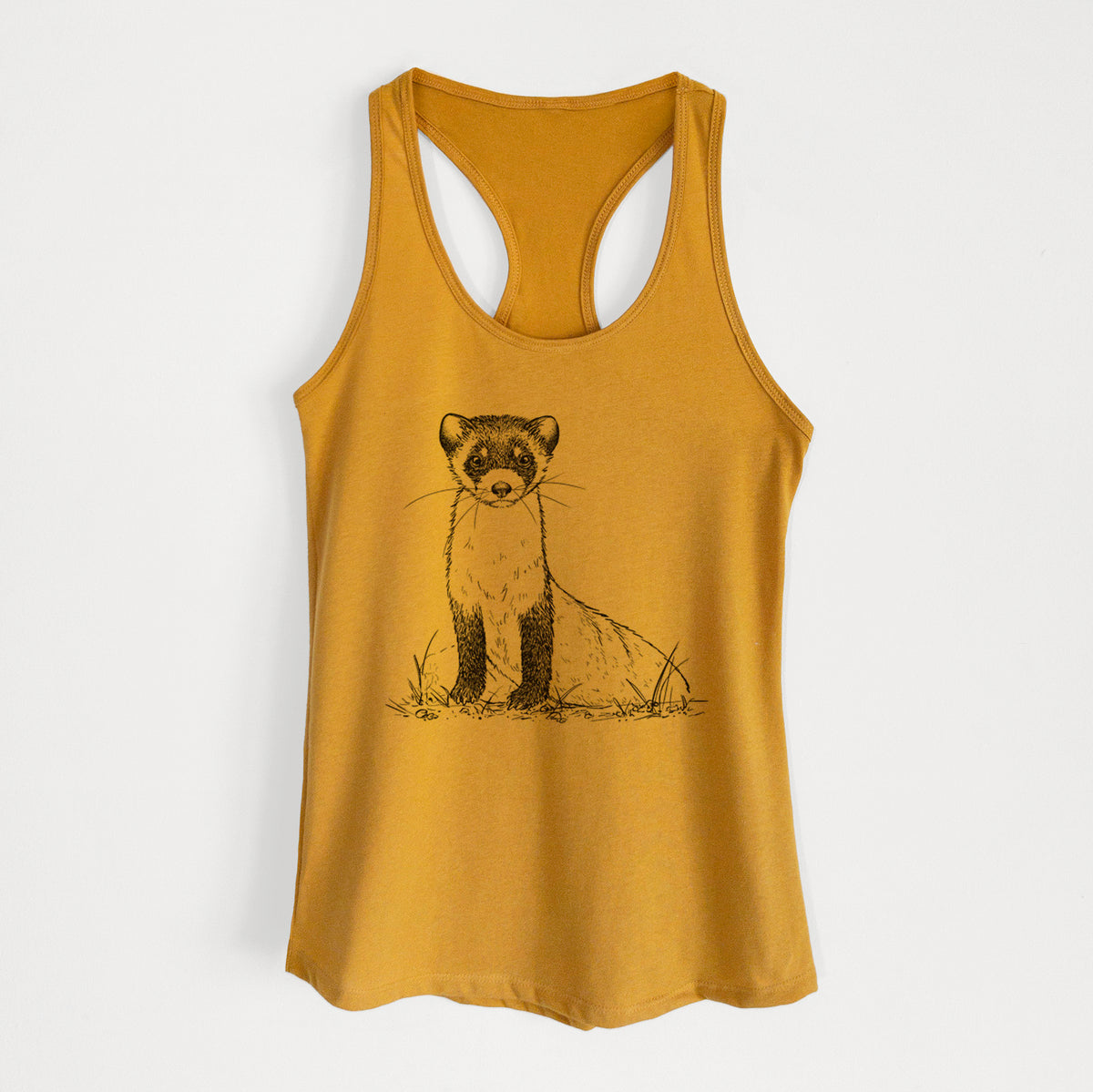 Gold women's racerback tank top laid flat, printed with a detailed black ink illustration of a black-footed ferret sitting on the ground.