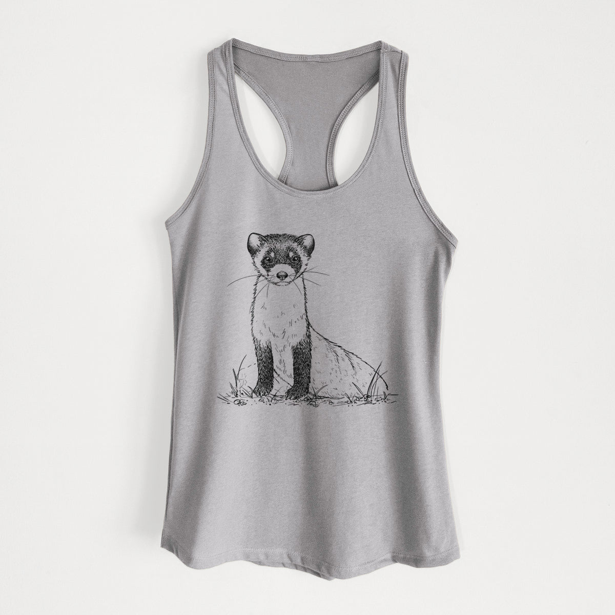 Heather grey women's racerback tank top laid flat, printed with a detailed black ink illustration of a black-footed ferret sitting on the ground.