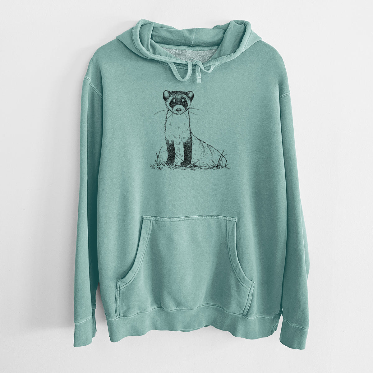 Mint green pigment dyed hoodie laid flat, printed with a detailed black ink illustration of a black-footed ferret sitting on the ground.
