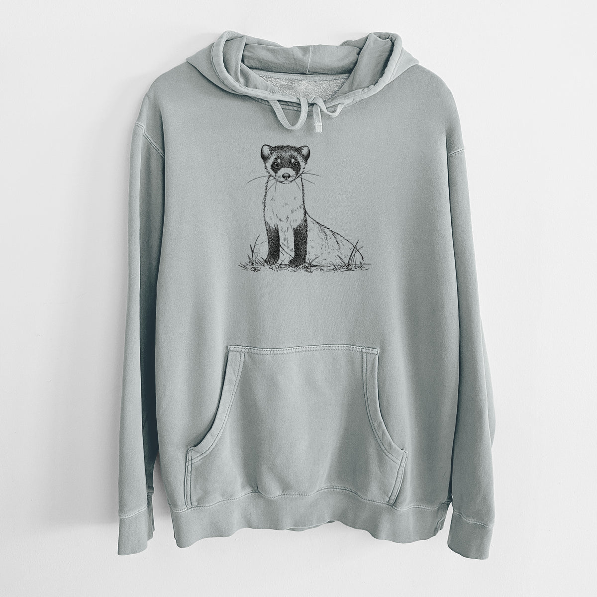 Sage green pigment dyed hoodie laid flat, printed with a detailed black ink illustration of a black-footed ferret sitting on the ground.