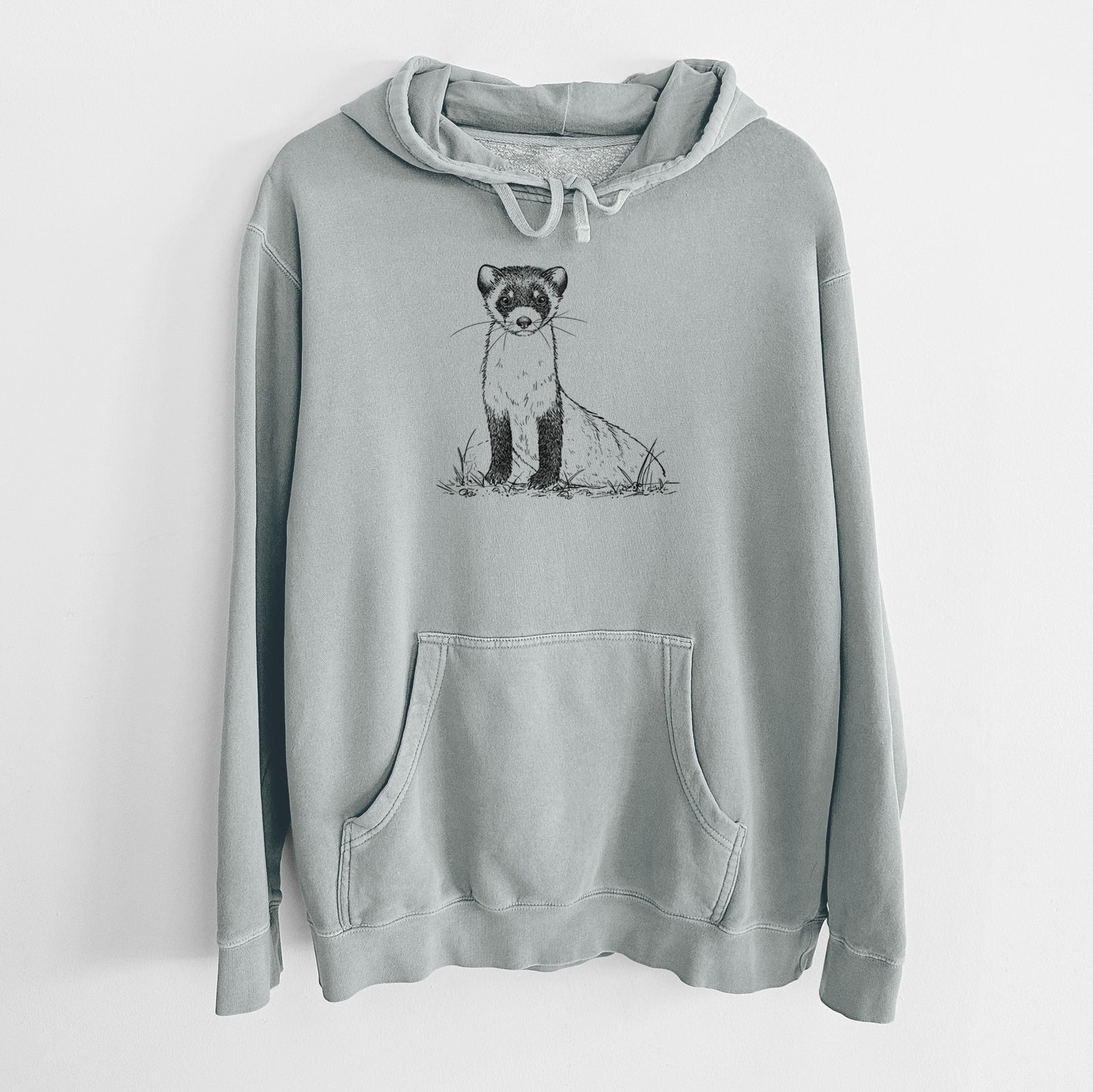 Sage green pigment dyed hoodie laid flat, printed with a detailed black ink illustration of a black-footed ferret sitting on the ground.