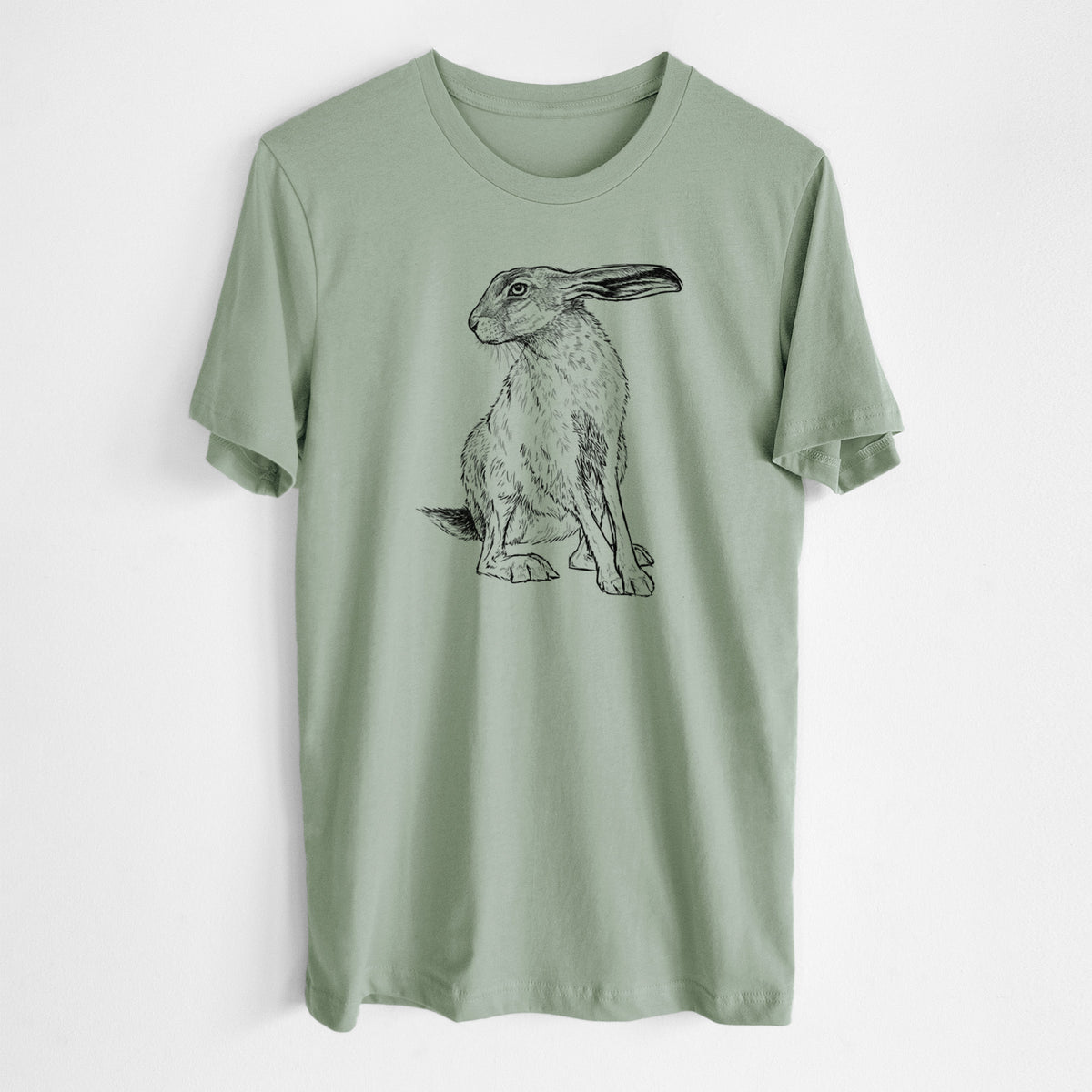 Sage green lightweight cotton t-shirt laid flat, printed with a detailed black ink illustration of a black-tailed jackrabbit sitting with long upright ears.