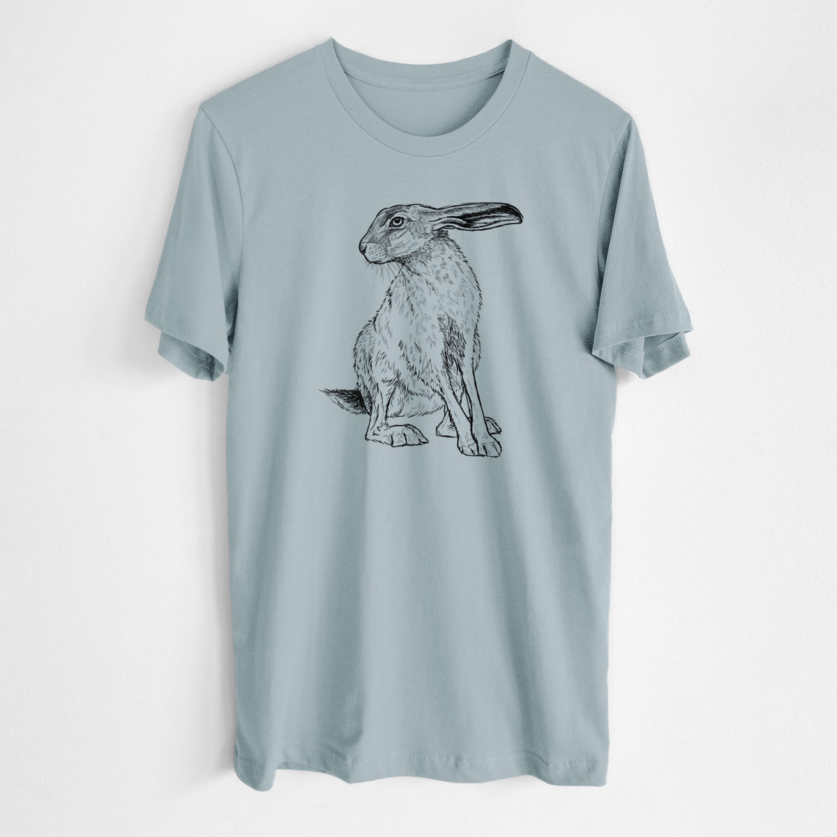 Vintage denim lightweight cotton t-shirt laid flat, printed with a detailed black ink illustration of a black-tailed jackrabbit sitting with long upright ears.