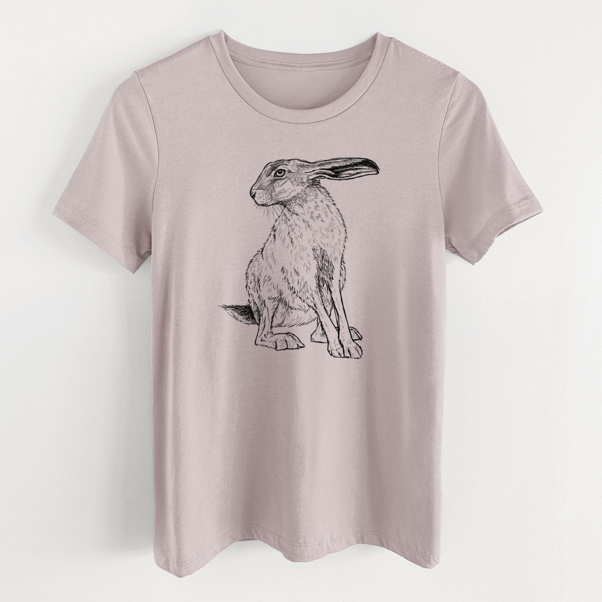 Pink gravel women's relaxed fit cotton t-shirt laid flat, printed with a detailed black ink illustration of a black-tailed jackrabbit sitting with long upright ears.