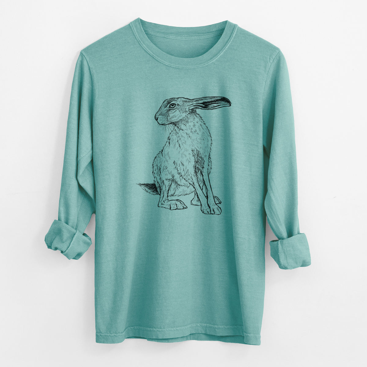 Reef green Comfort Colors long sleeve shirt laid flat with the cuffs rolled, printed with a detailed black ink illustration of a black-tailed jackrabbit sitting with long upright ears.