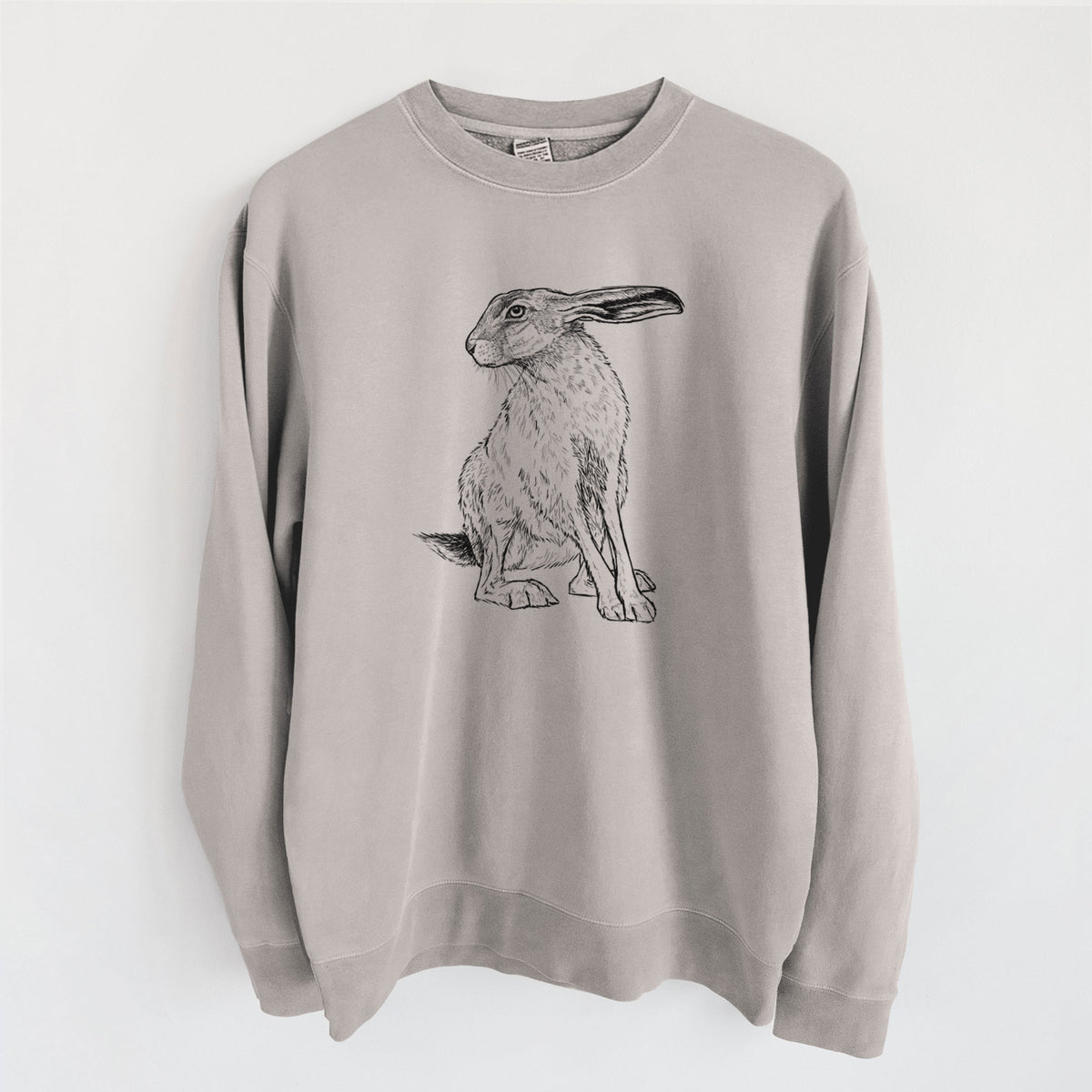 Cement grey pigment dyed crewneck sweatshirt laid flat, printed with a detailed black ink illustration of a black-tailed jackrabbit sitting with long upright ears.