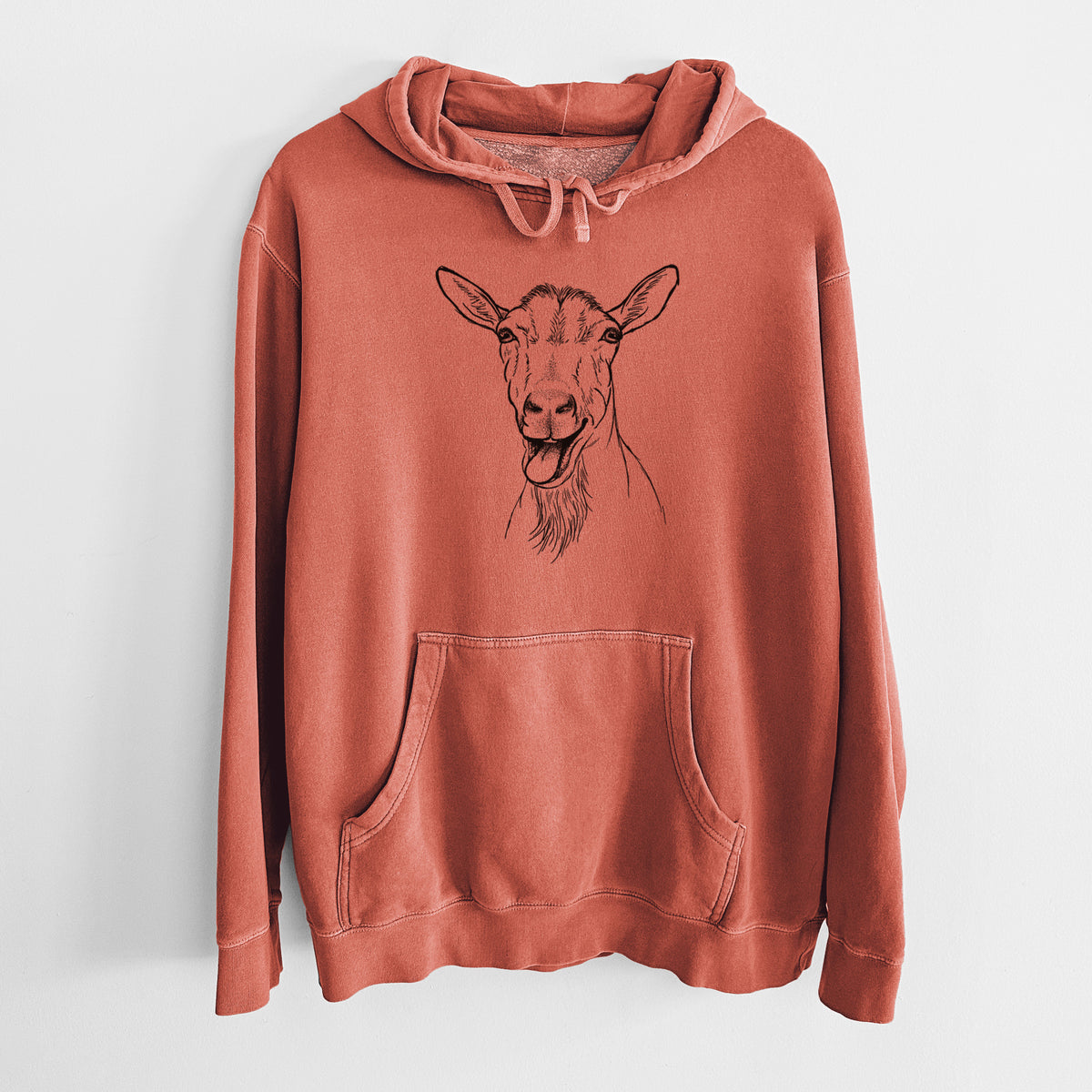 Amber orange pigment dyed hoodie laid flat, printed with a black ink illustration of a goat's head with its mouth open mid-bleat and its tongue out.