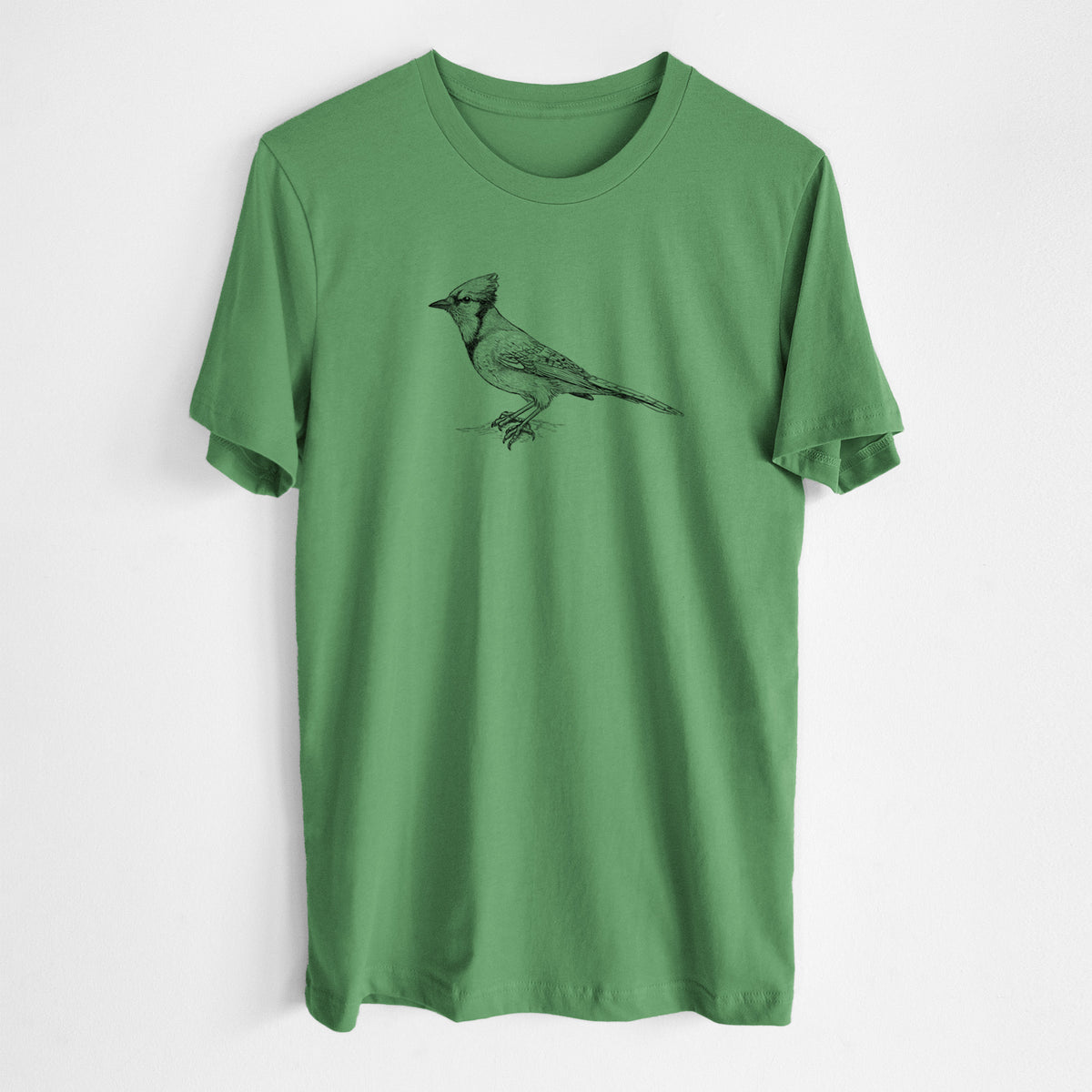 Leaf green lightweight cotton t-shirt laid flat, printed with a detailed black ink sketch of a blue jay perched with its crest raised.