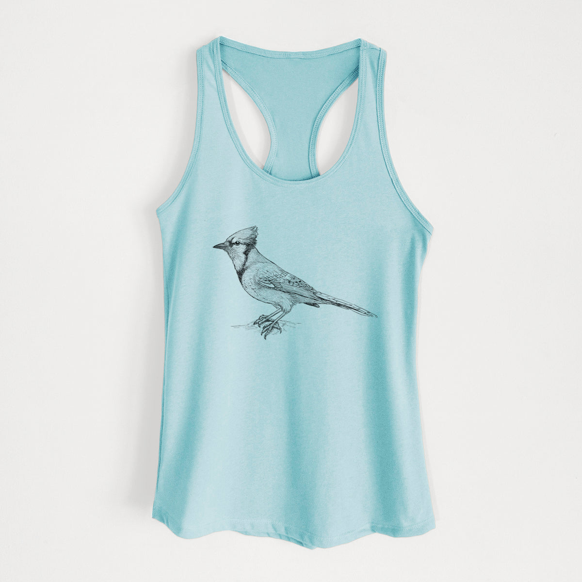 Cancun blue women's racerback tank top laid flat, printed with a detailed black ink sketch of a blue jay perched with its crest raised.