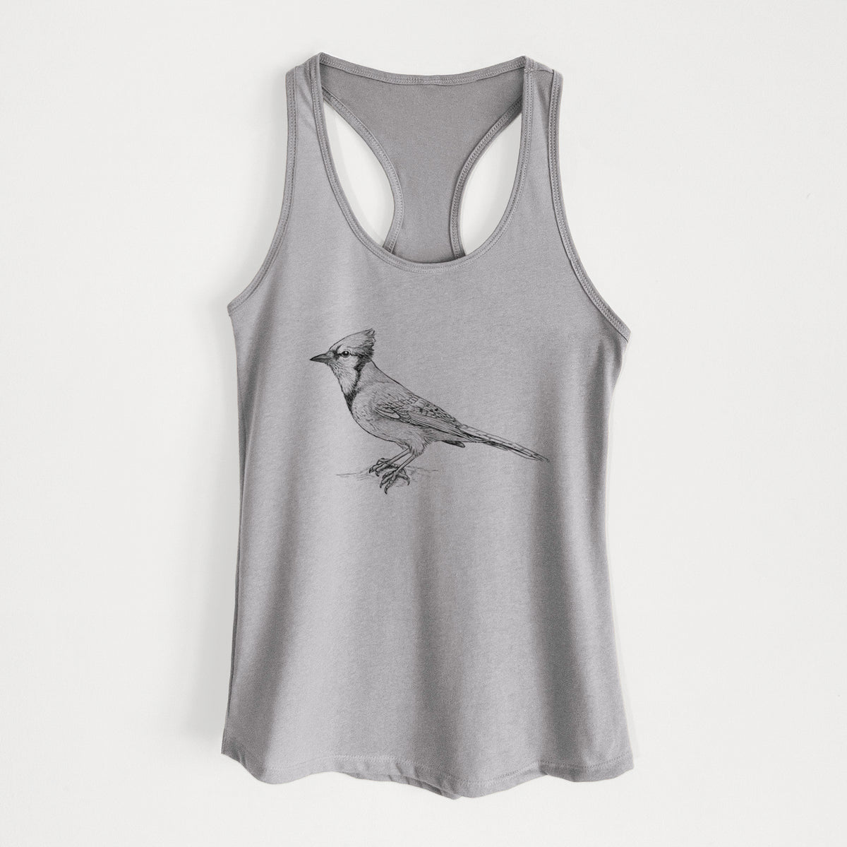 Heather grey women's racerback tank top laid flat, printed with a detailed black ink sketch of a blue jay perched with its crest raised.