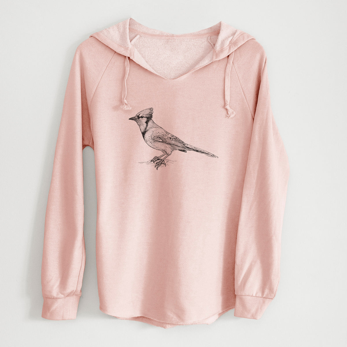 Blush pink women's Cali Wave hooded sweatshirt laid flat, printed with a detailed black ink sketch of a blue jay perched with its crest raised.