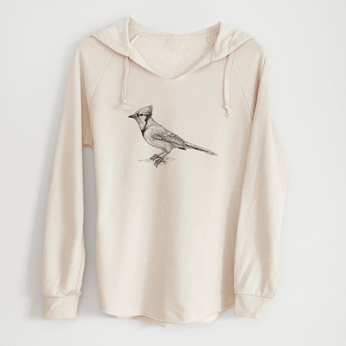 Bone cream women's Cali Wave hooded sweatshirt laid flat, printed with a detailed black ink sketch of a blue jay perched with its crest raised.