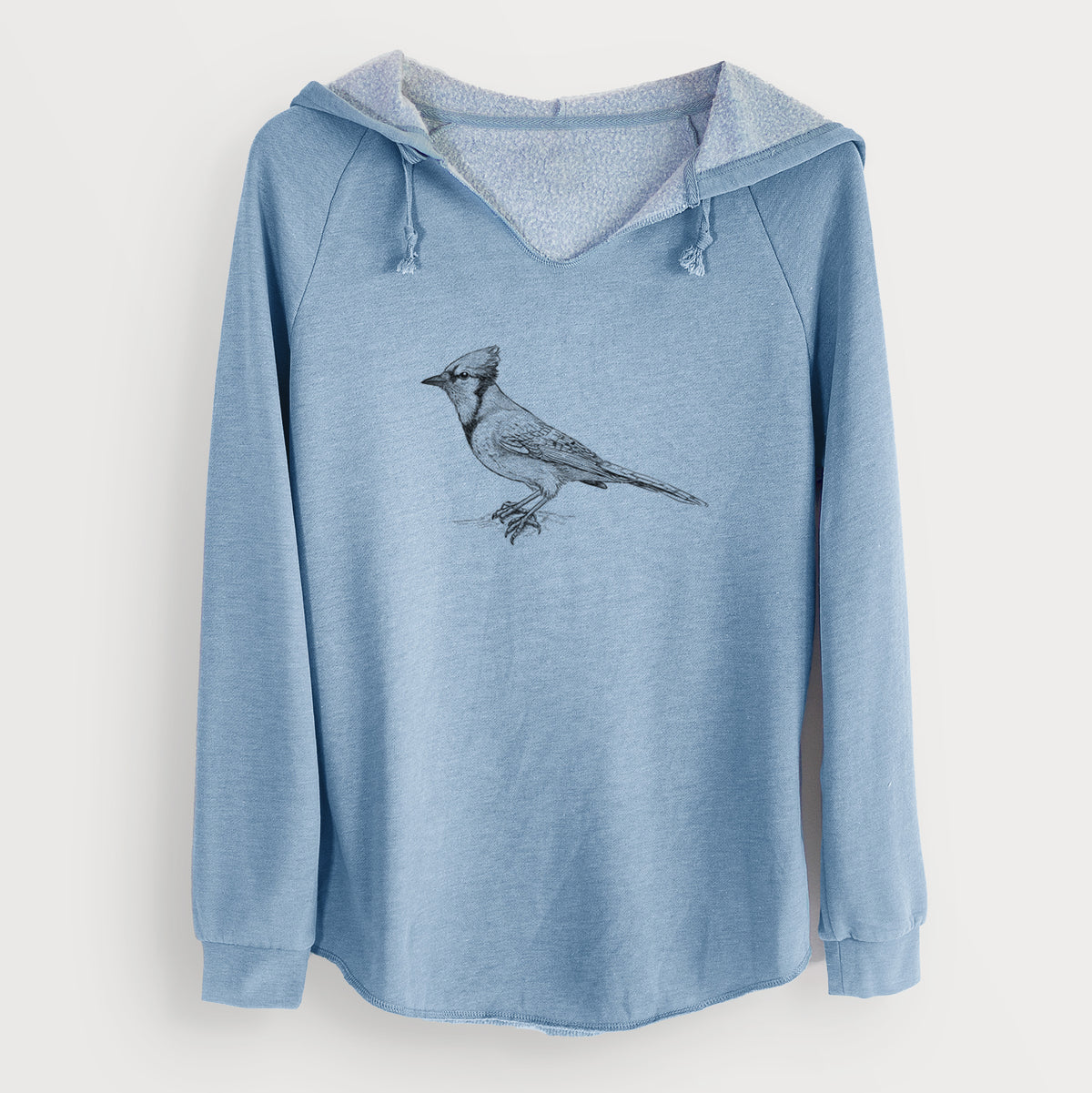 Misty blue women's Cali Wave hooded sweatshirt laid flat, printed with a detailed black ink sketch of a blue jay perched with its crest raised.