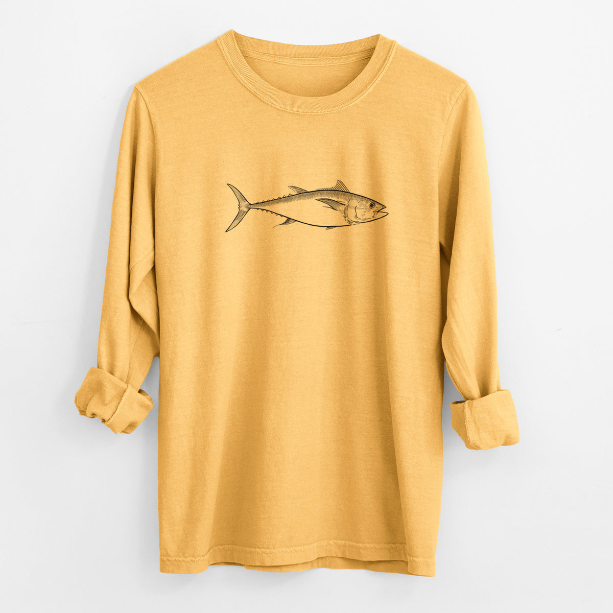 Golden wheat yellow Comfort Colors long sleeve shirt laid flat with the cuffs rolled, printed with a black ink line drawing of a bluefin tuna swimming.