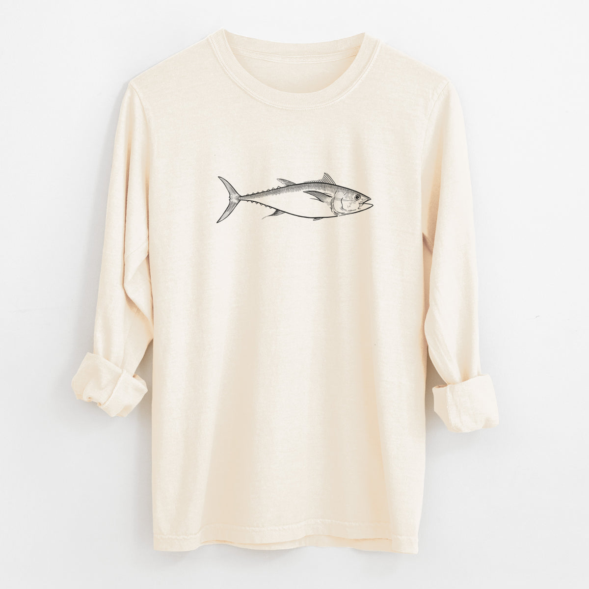 Ivory Comfort Colors long sleeve shirt laid flat with the cuffs rolled, printed with a black ink line drawing of a bluefin tuna swimming.