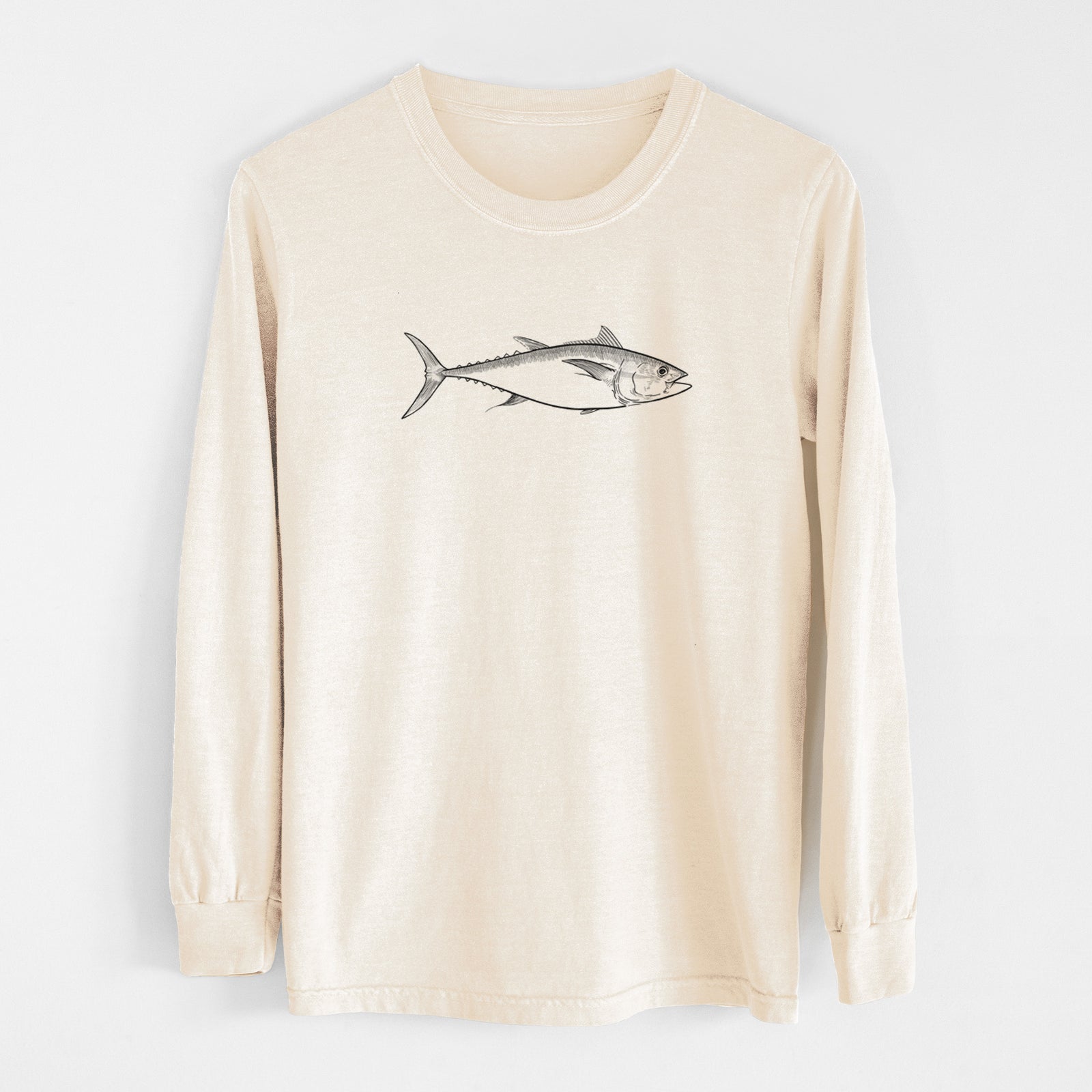 Ivory Comfort Colors long sleeve shirt laid flat, printed with a black ink line drawing of a bluefin tuna swimming.