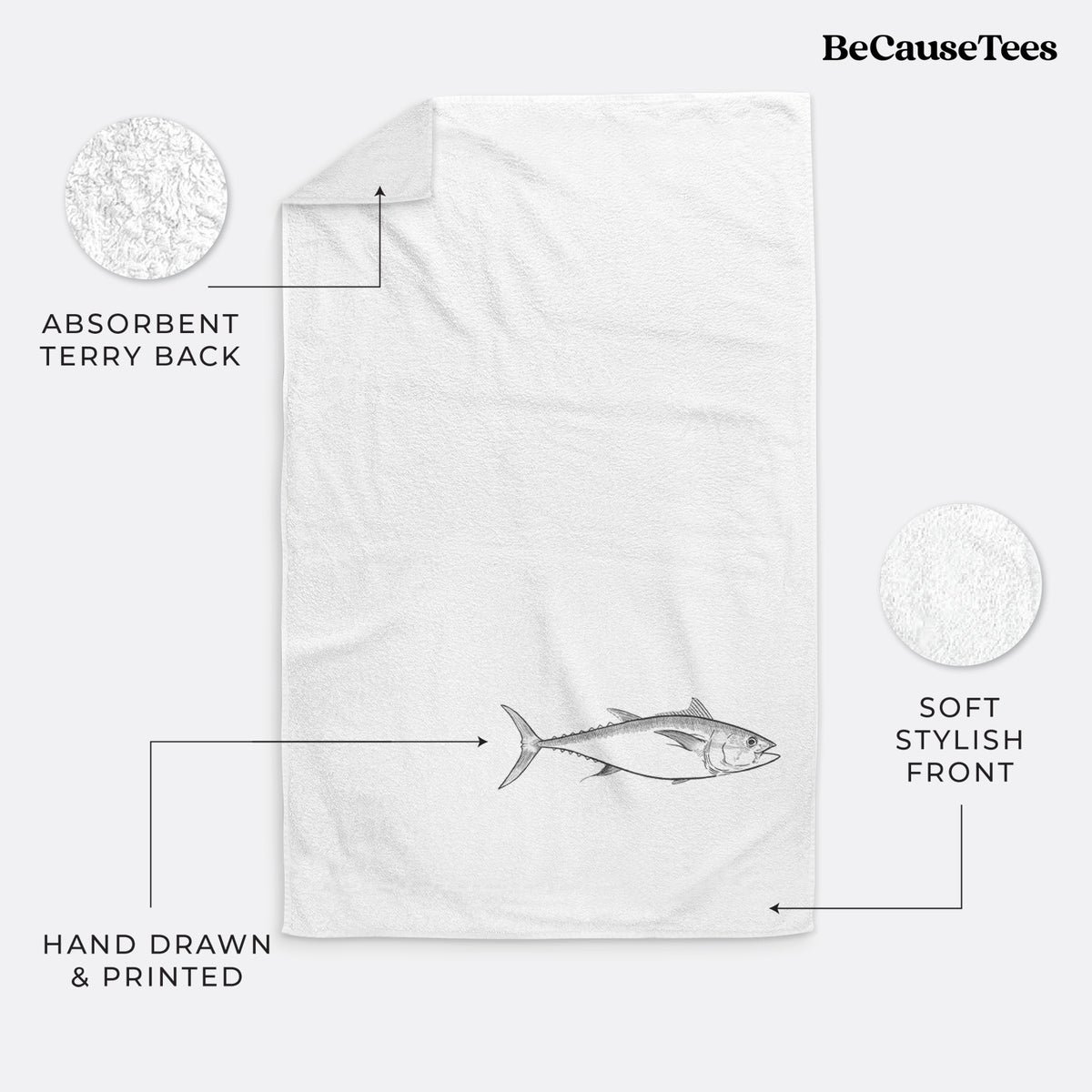 White hand towel printed with a black ink line drawing of a bluefin tuna swimming.