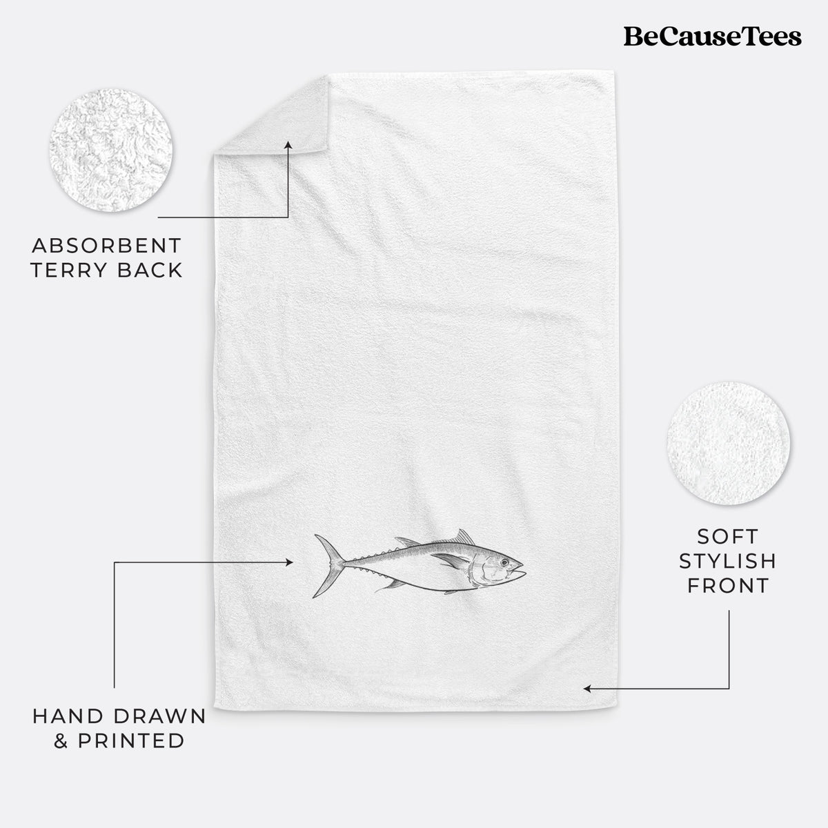 White hand towel printed with a black ink line drawing of a bluefin tuna swimming.