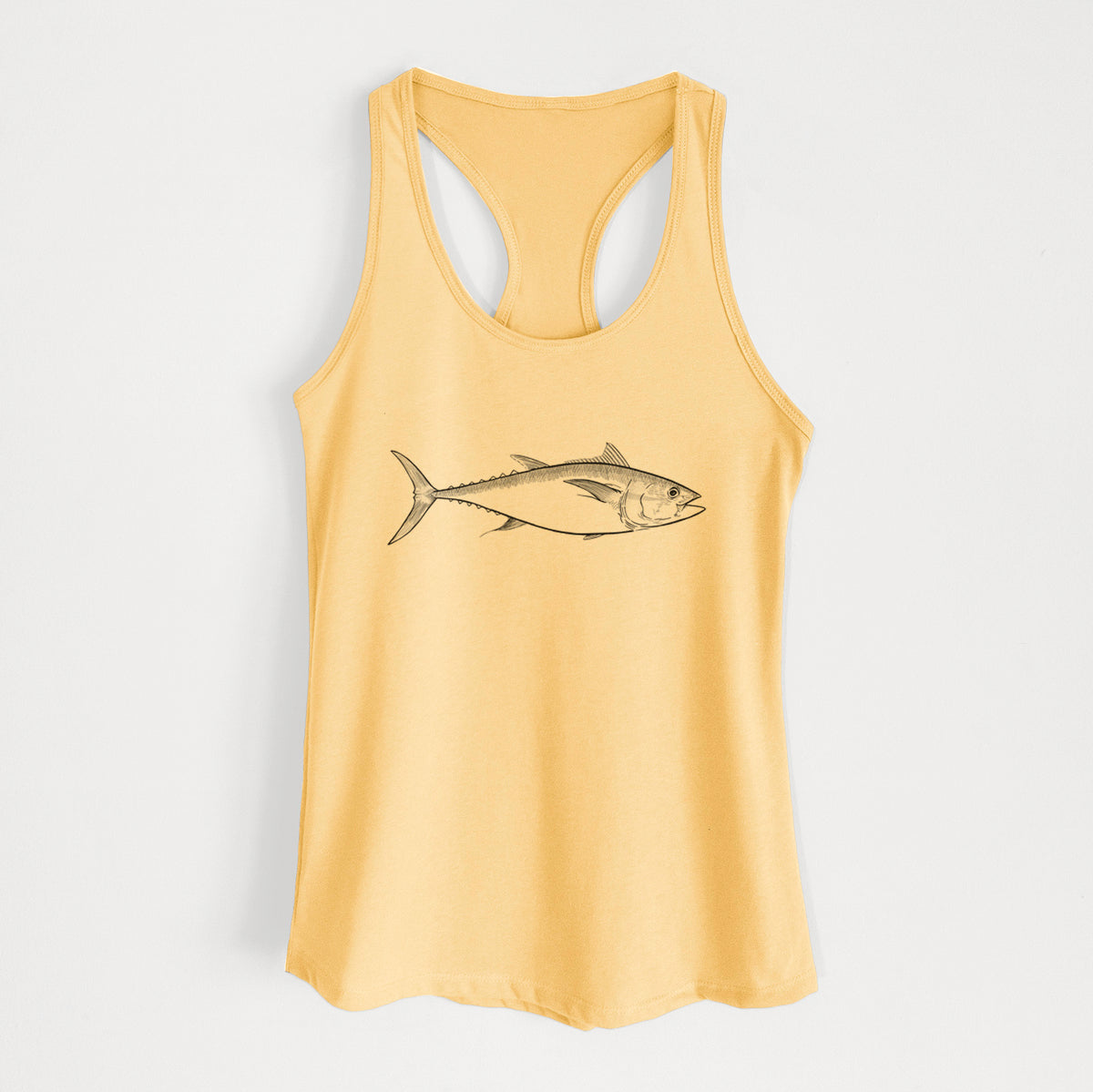 Banana cream women's racerback tank top laid flat, printed with a black ink line drawing of a bluefin tuna swimming.