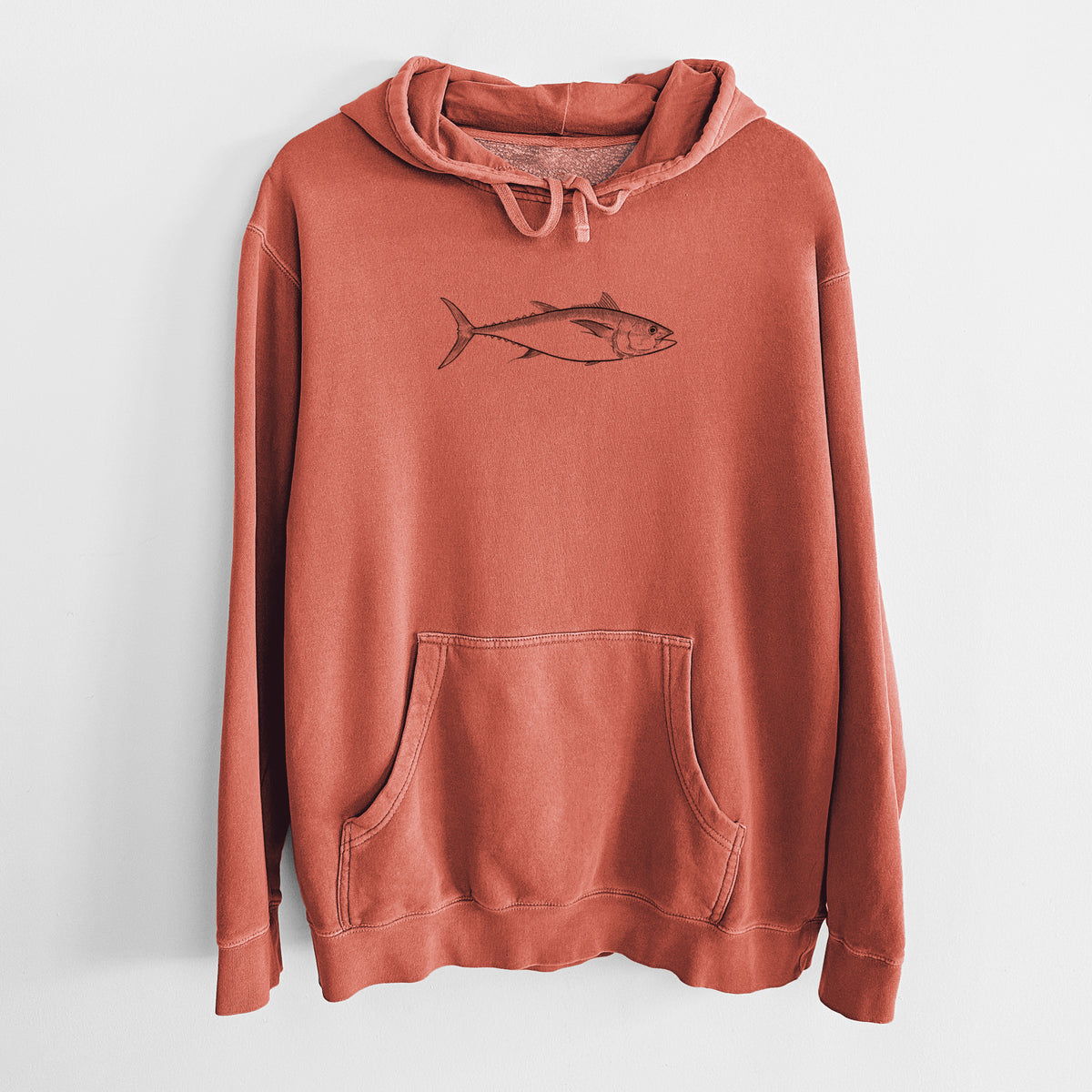 Amber orange pigment dyed hoodie laid flat, printed with a black ink line drawing of a bluefin tuna swimming.