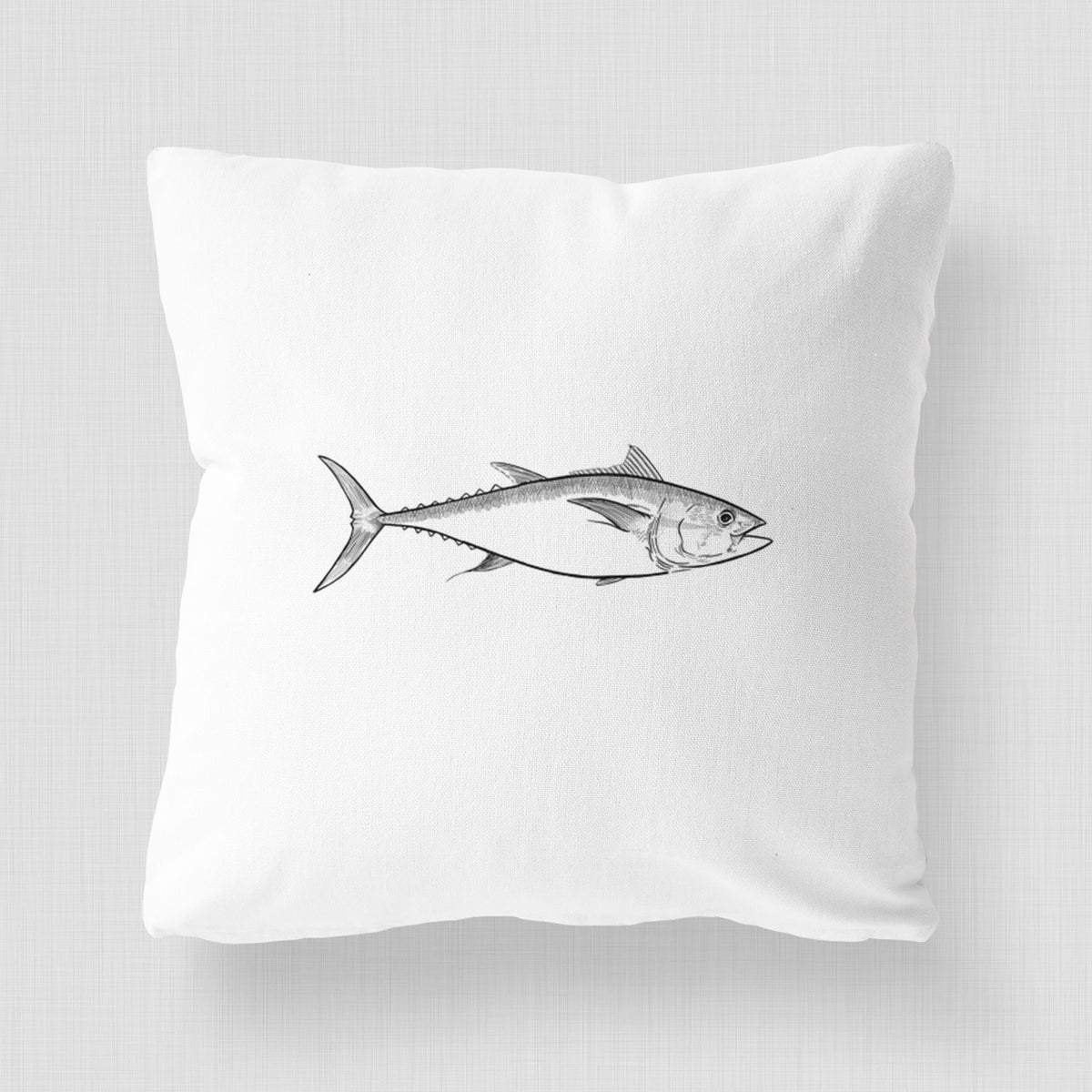 White pillow cover printed with a black ink line drawing of a bluefin tuna swimming.