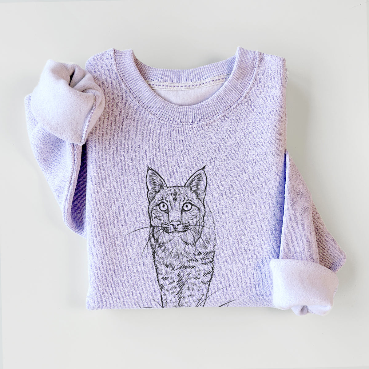 Ice purple knit sweatshirt printed with a black ink illustration of a bobcat standing in tall grass, facing forward, styled flat.