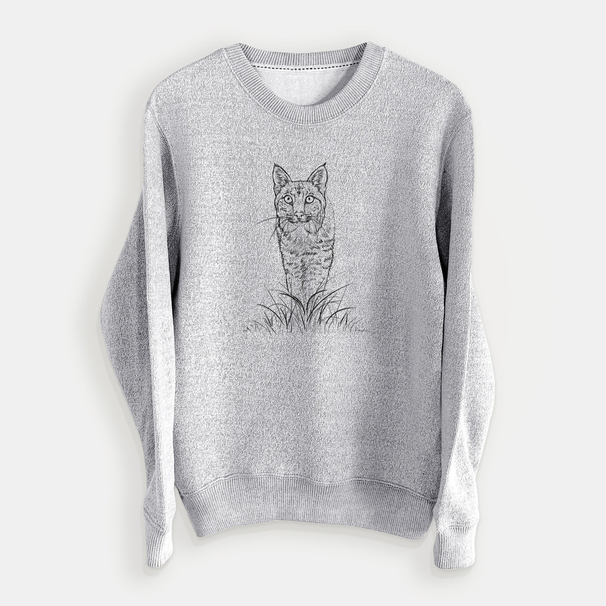 Salt and pepper knit sweatshirt laid flat, printed with a black ink illustration of a bobcat standing in tall grass, facing forward.