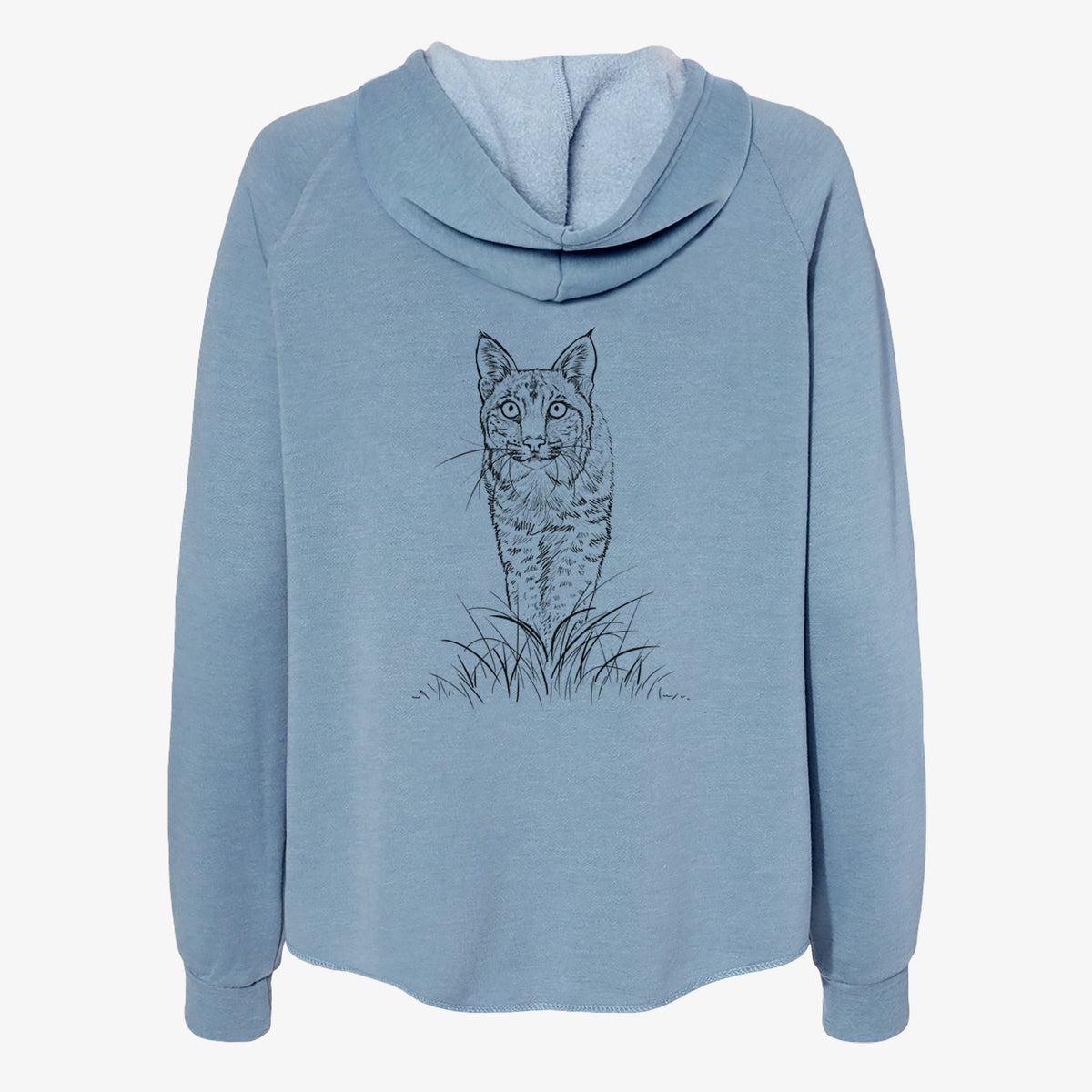 Misty blue women's Cali Wave zip-up sweatshirt laid flat, printed with a black ink illustration of a bobcat standing in tall grass, facing forward.