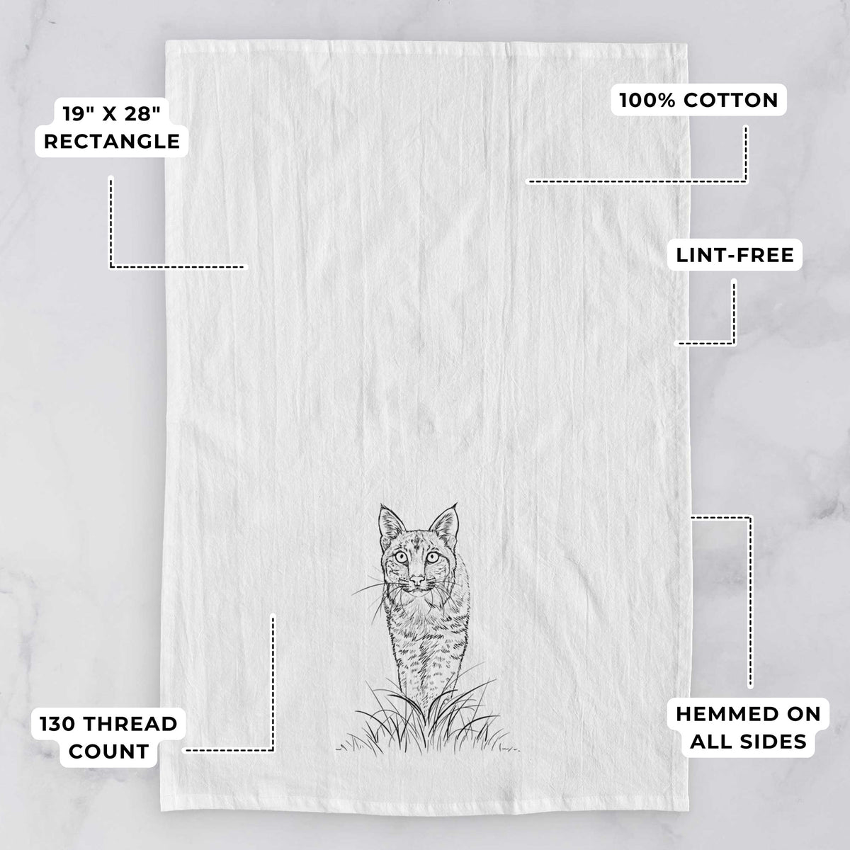 White tea towel printed with a black ink illustration of a bobcat standing in tall grass, facing forward, with feature labels: 19 by 28 inch rectangle, 100% cotton, lint-free, 130 thread count, hemmed on all sides.