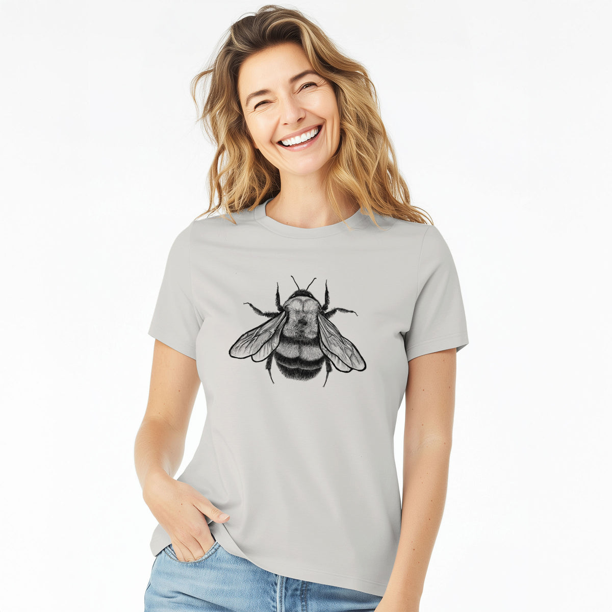 Woman wearing a lunar grey women's relaxed fit cotton t-shirt printed with a detailed black ink illustration of a rusty patched bumble bee with its wings spread, seen from above.
