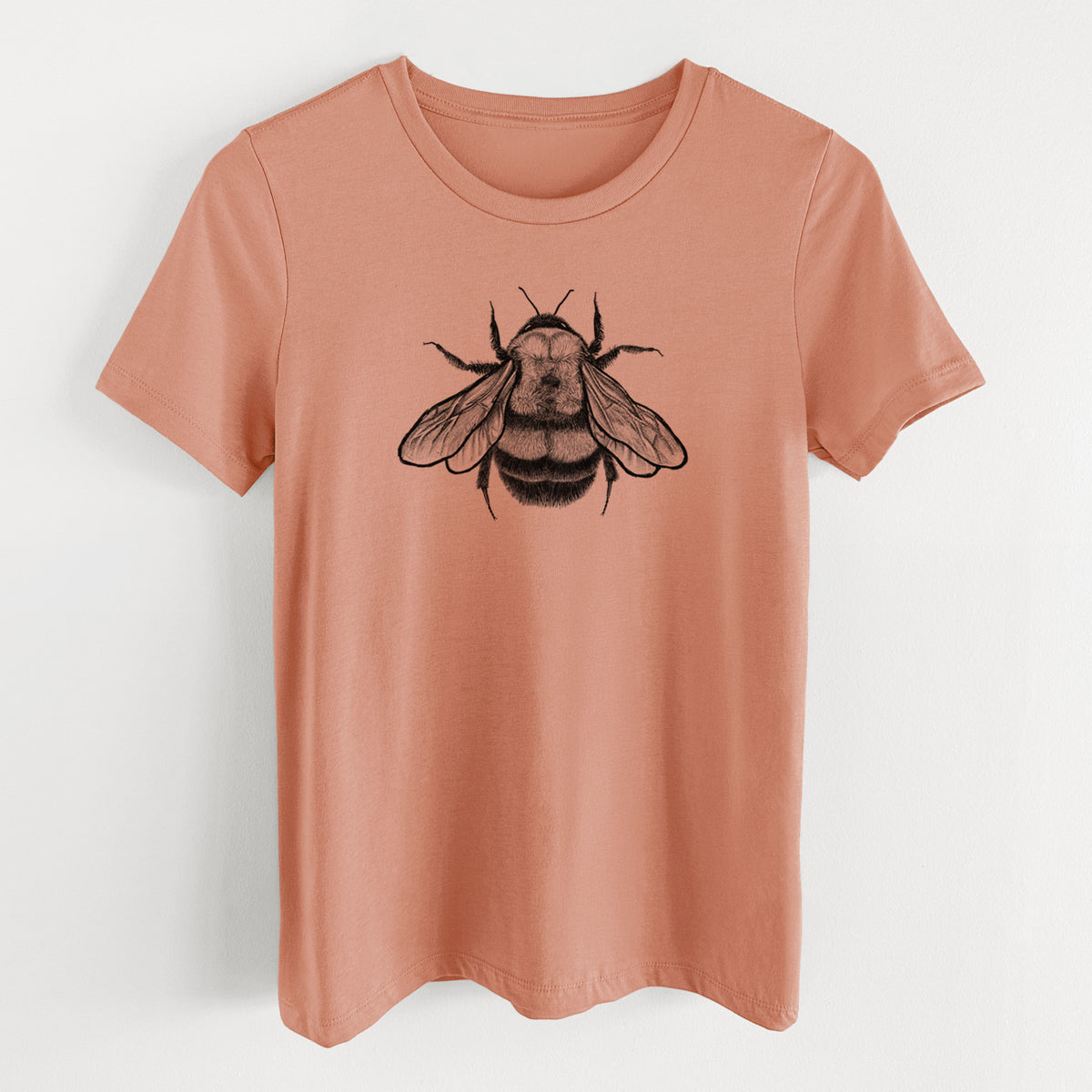 Terracotta orange women's relaxed fit cotton t-shirt laid flat, printed with a detailed black ink illustration of a rusty patched bumble bee with its wings spread, seen from above.