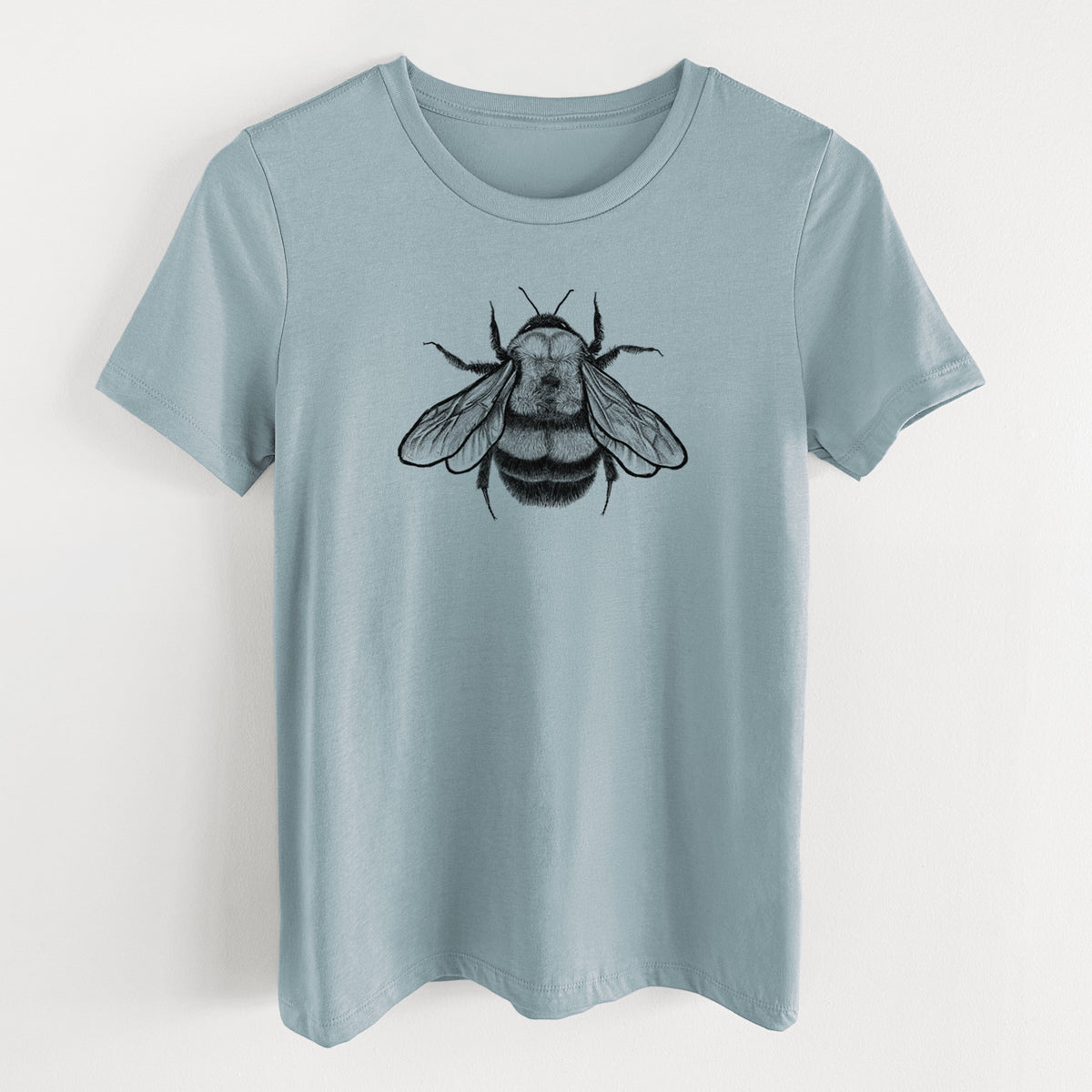 Vintage denim women's relaxed fit cotton t-shirt laid flat, printed with a detailed black ink illustration of a rusty patched bumble bee with its wings spread, seen from above.